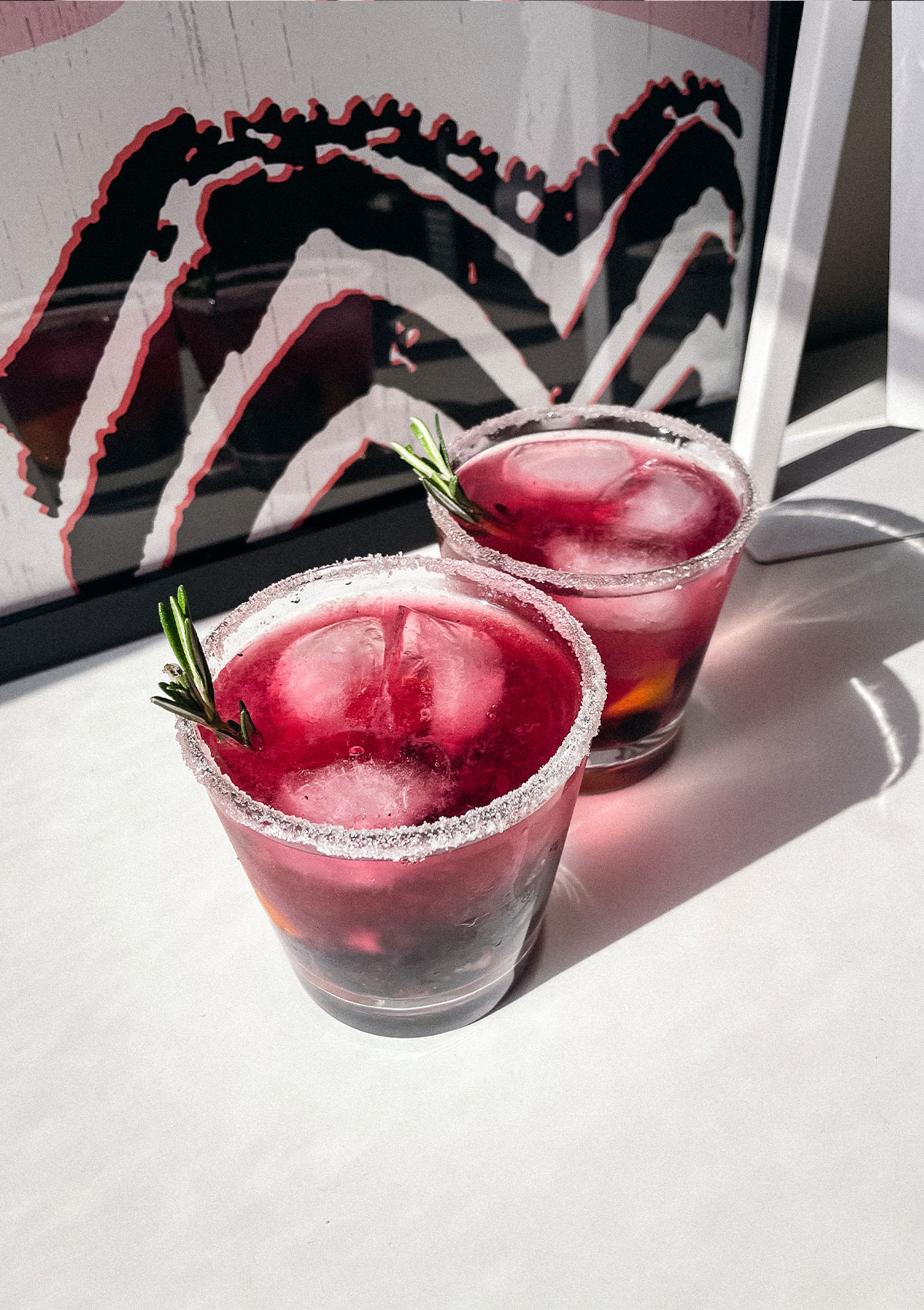 Blueberry Lemon Smash craft cocktails in sugar-rimmed glasses