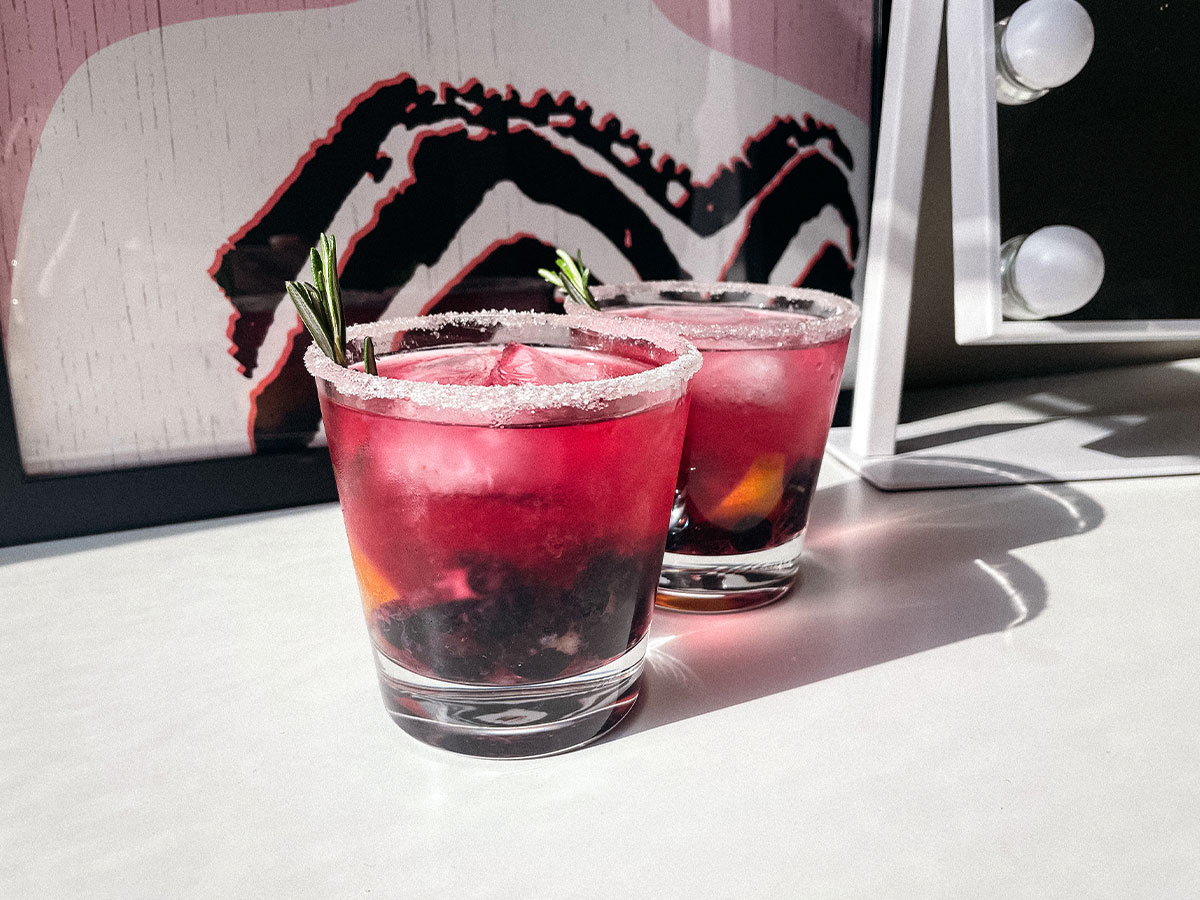 Blueberry Lemon Smash craft cocktails in sugar-rimmed glasses