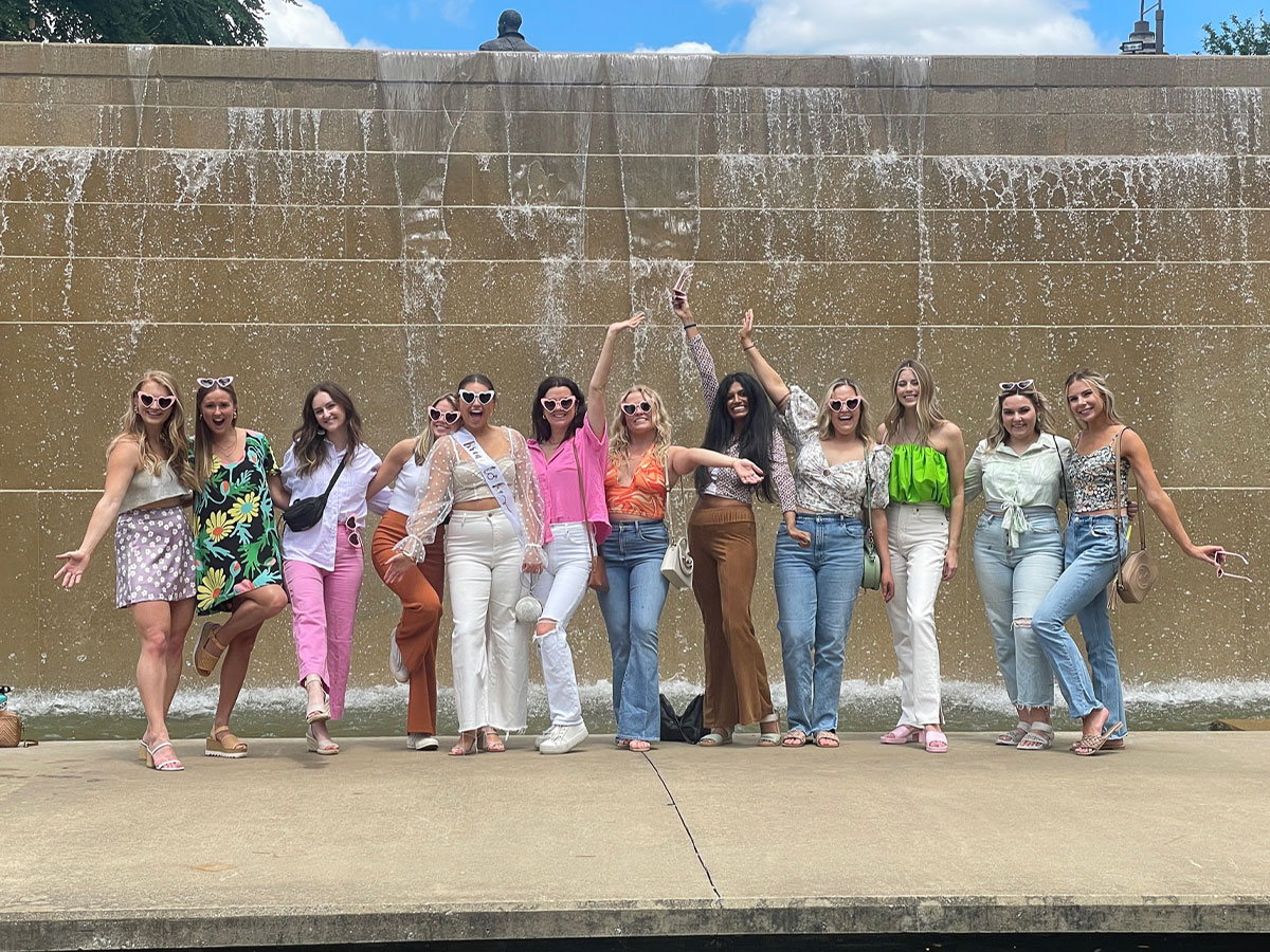 Group of friends posing in downtown Louisville, Kentucky