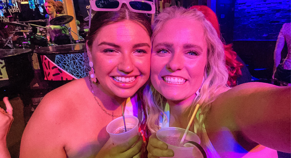 Bride and friend at Howl at the Moon in Louisville, Kentucky