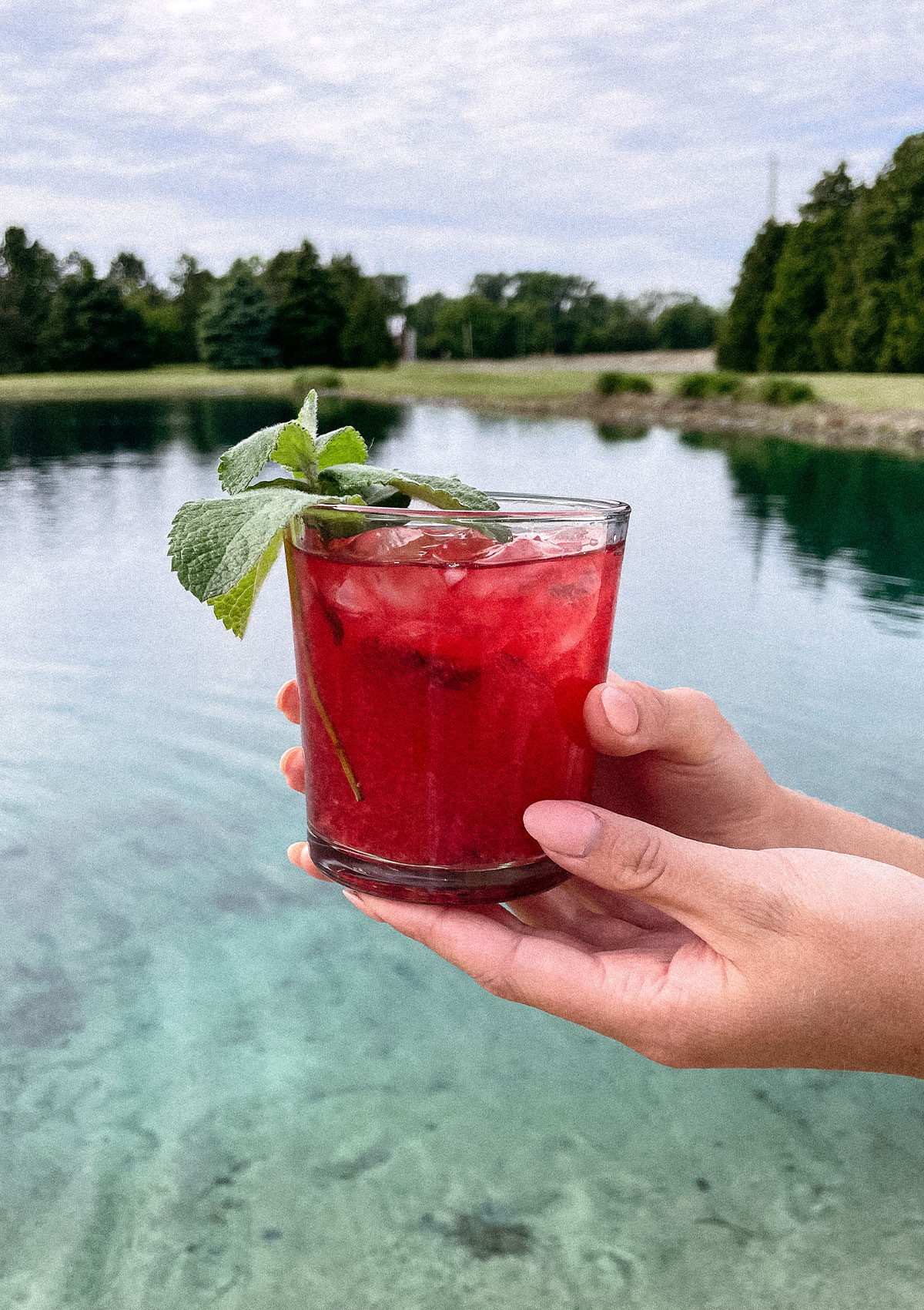 Beautiful Blackberry Mojito cocktail at the beach