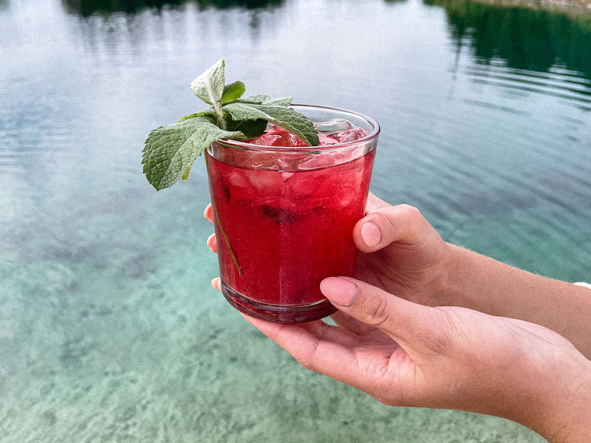 Beautiful Blackberry Mojito cocktail at the beach