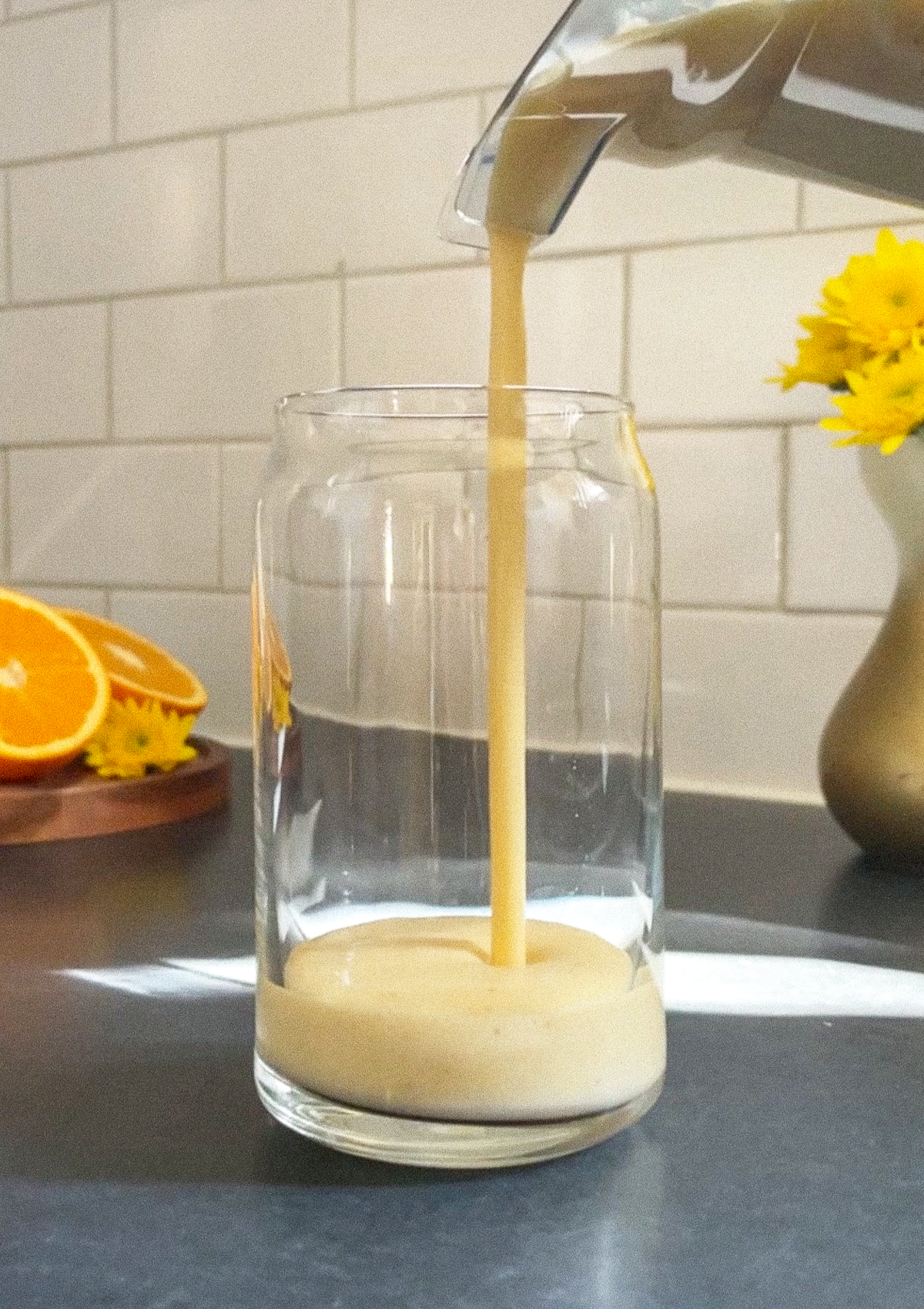 Orange Dream Smoothie being poured from the blender to a glass