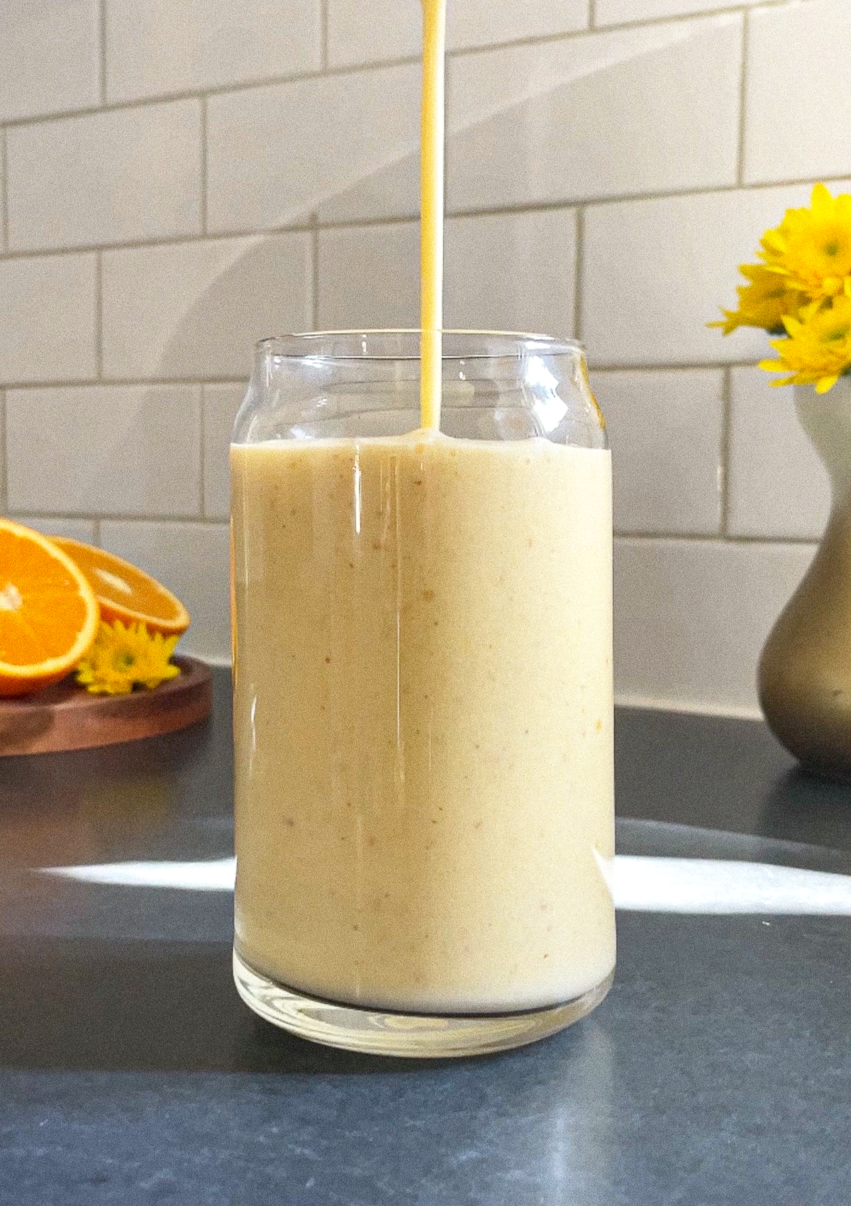 Delicious Orange Dream Smoothie being poured into a glass