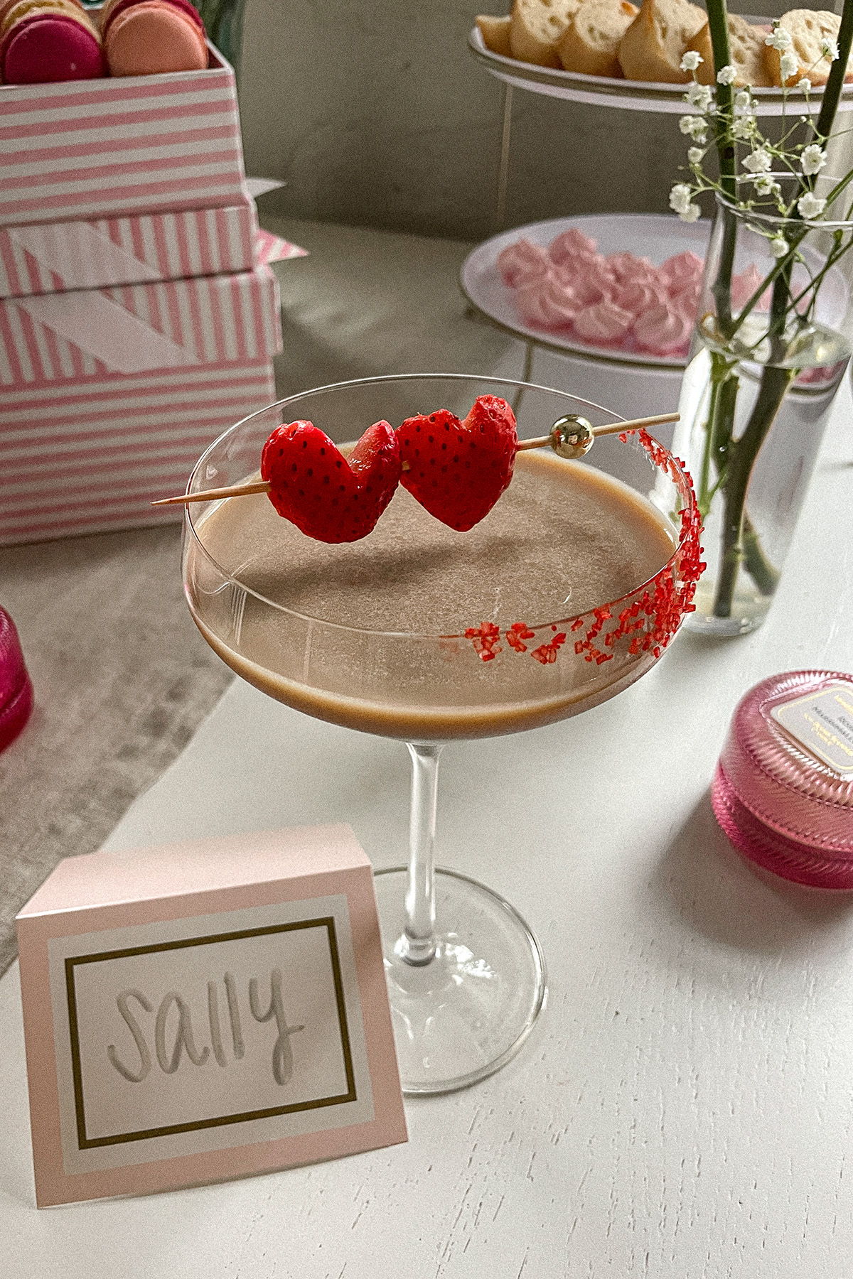 Baileys Chocolate Espresso Martini garnished with red sugar sprinkles and heart-shaped strawberries