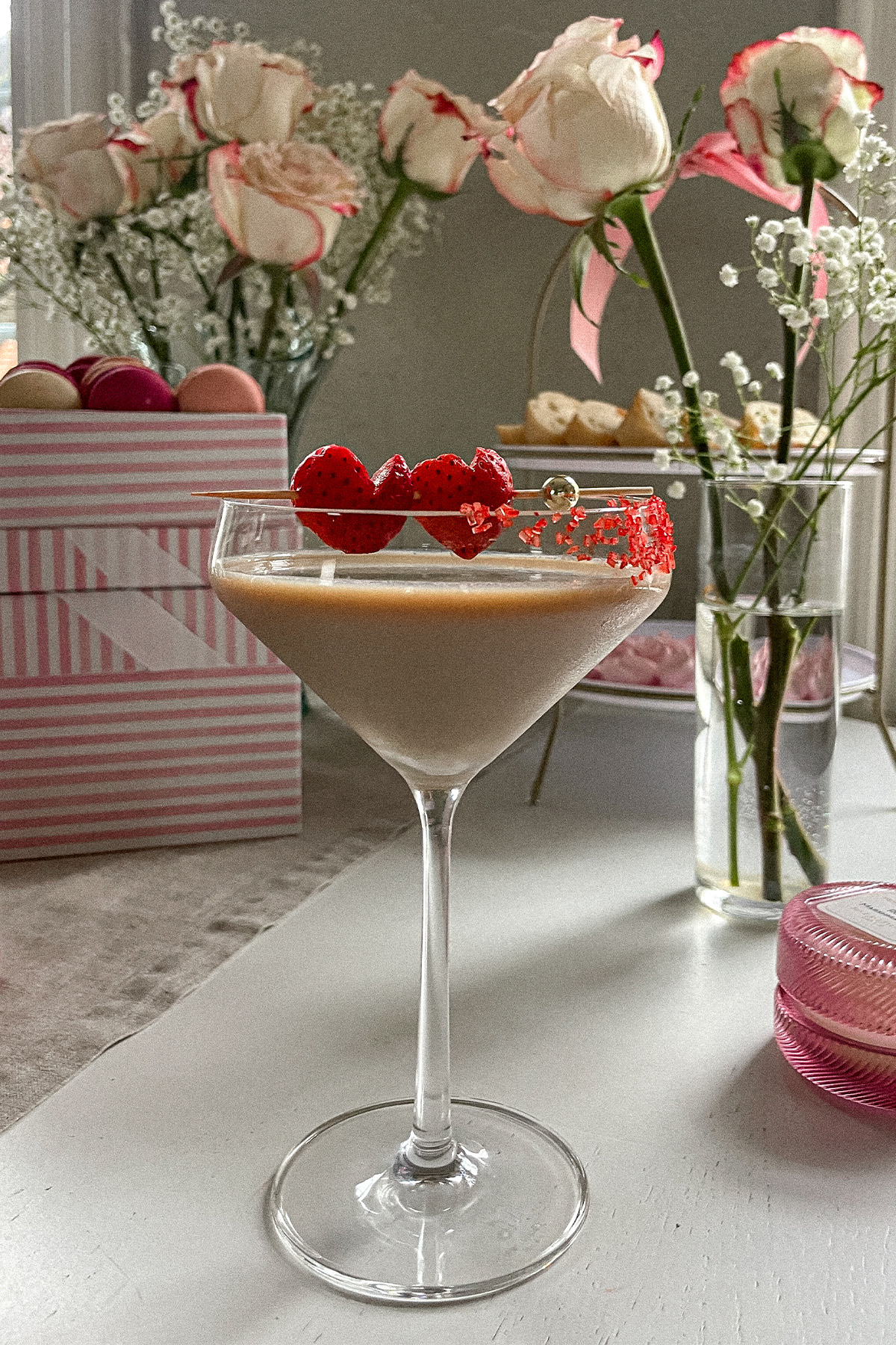 Baileys Chocolate Espresso Martini garnished with red sugar sprinkles and heart-shaped strawberries