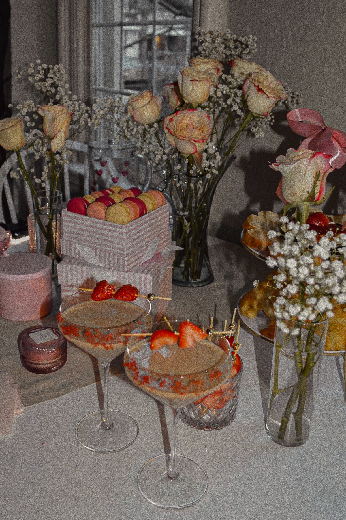 Baileys Chocolate Espresso Martinis on a beautiful table filled with roses, candles and macarons