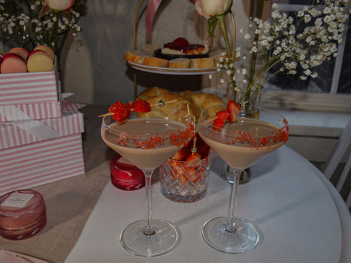 Baileys Chocolate Espresso Martinis surrounded by Valentine's Day flowers and appetizers