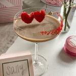 Baileys Chocolate Espresso Martini garnished with red sugar sprinkles and heart-shaped strawberries