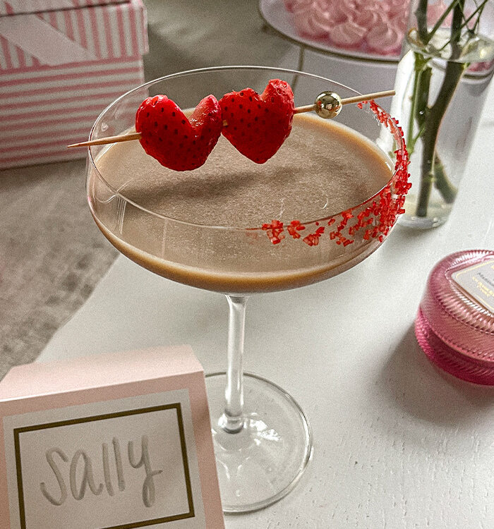 Baileys Chocolate Espresso Martini garnished with red sugar sprinkles and heart-shaped strawberries