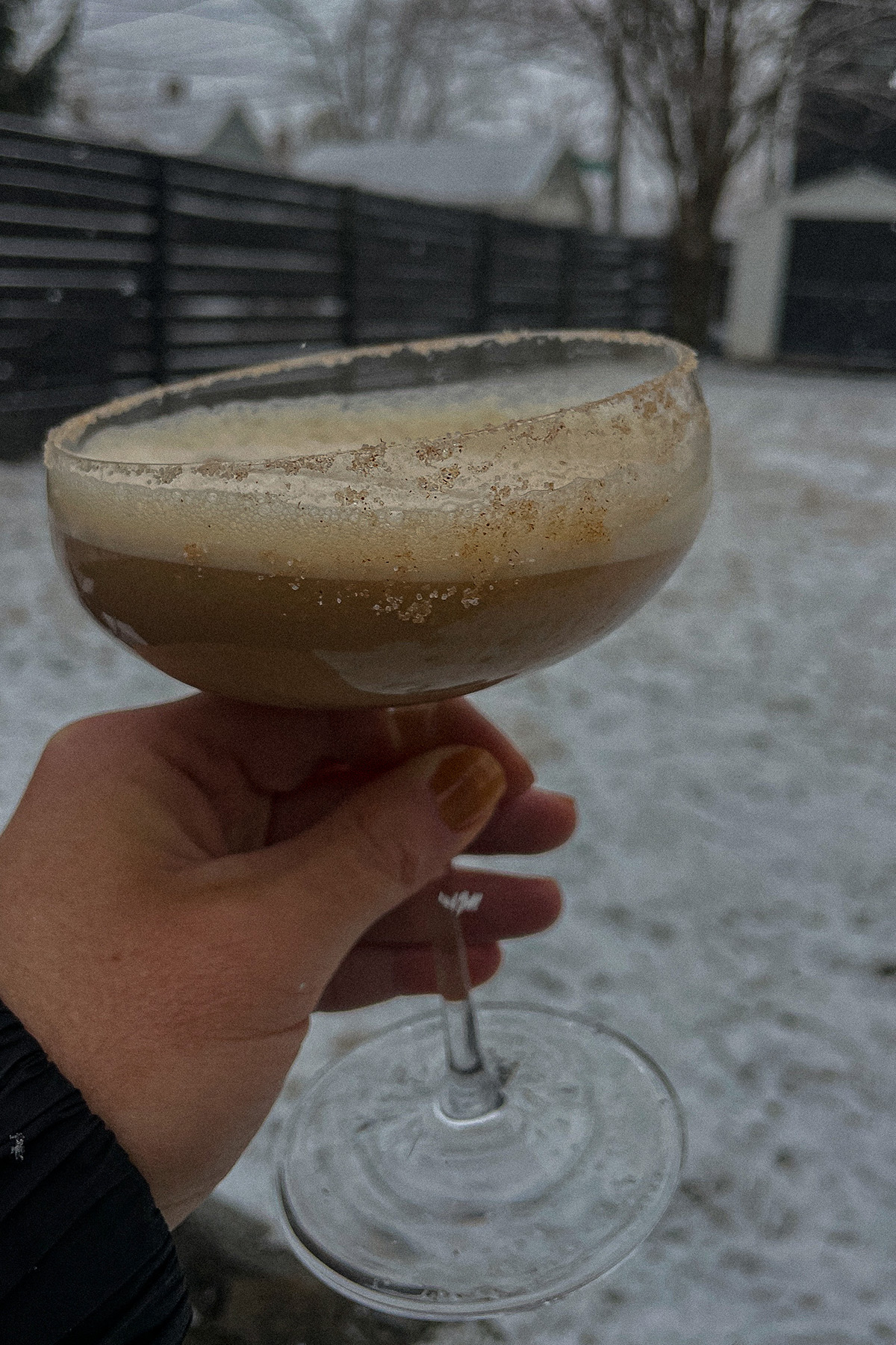 Dirty Chai Martini in a glass garnished with cinnamon sugar