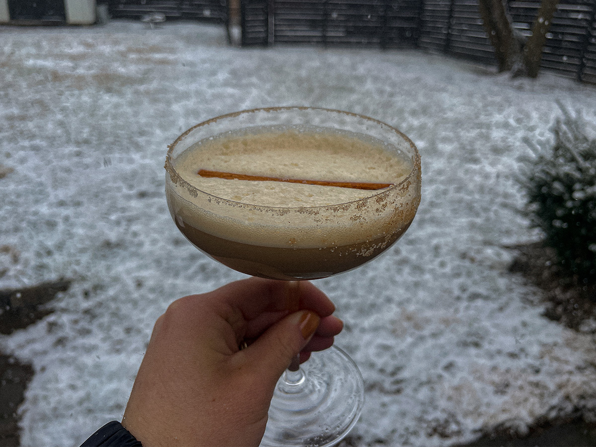 Creamy Dirty Chai Martini topped with a cinnamon stick