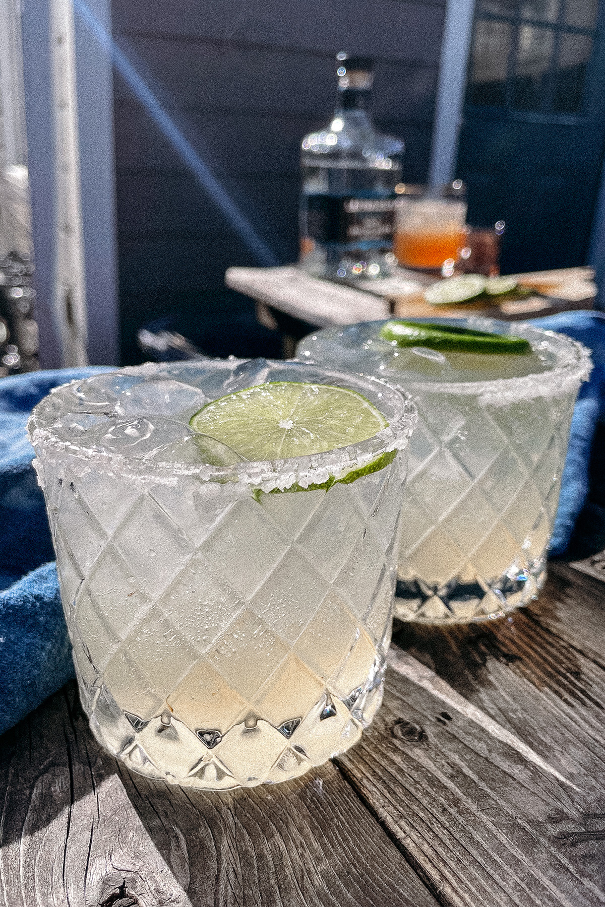 Skinny Margaritas served in salt-rimmed glasses topped with a wheel of lime