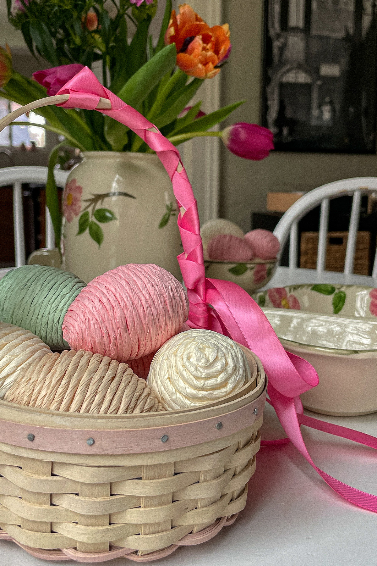 Easter basket filled with decorative pastel eggs