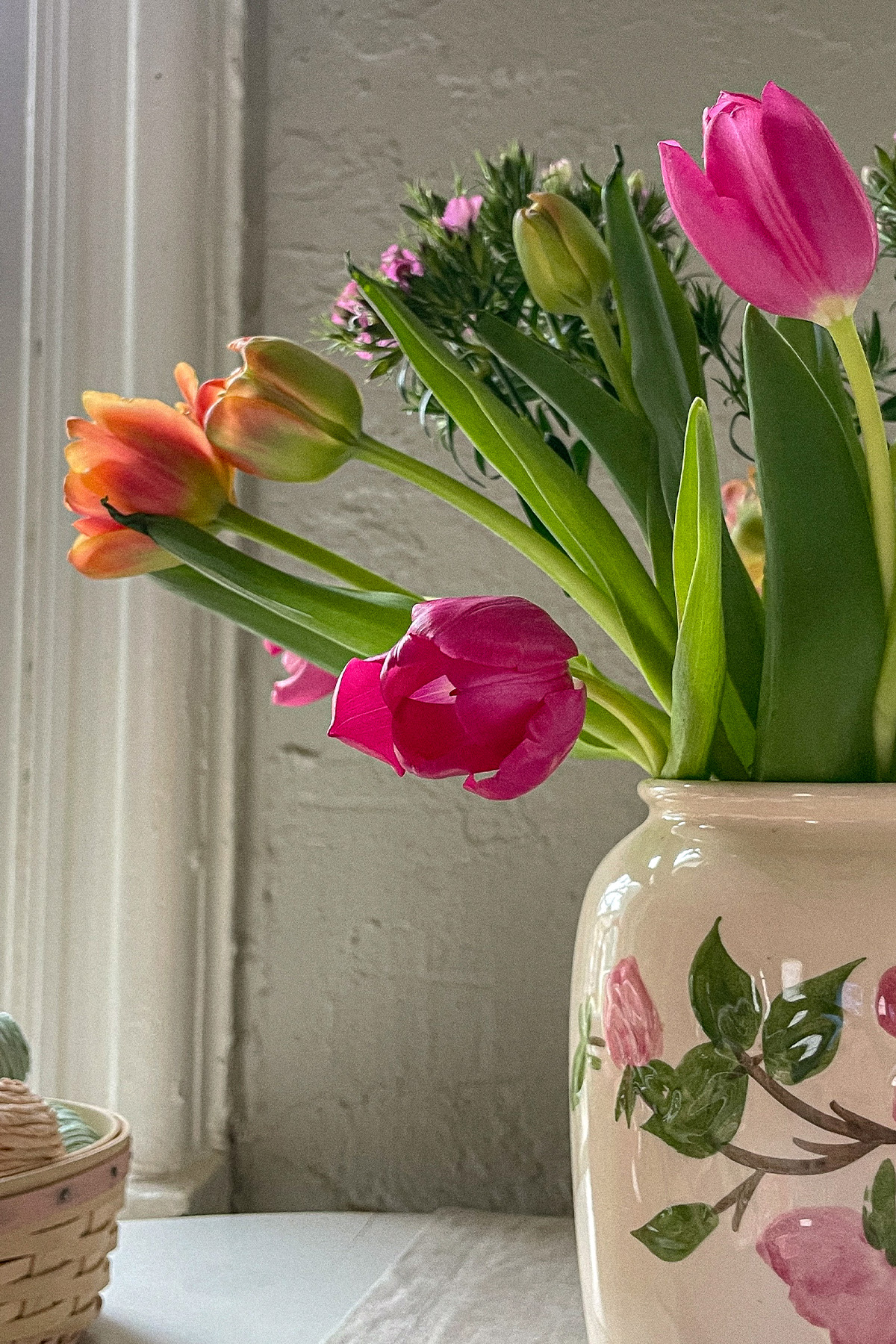 Colorful bouquet of spring flowers in an antique vase