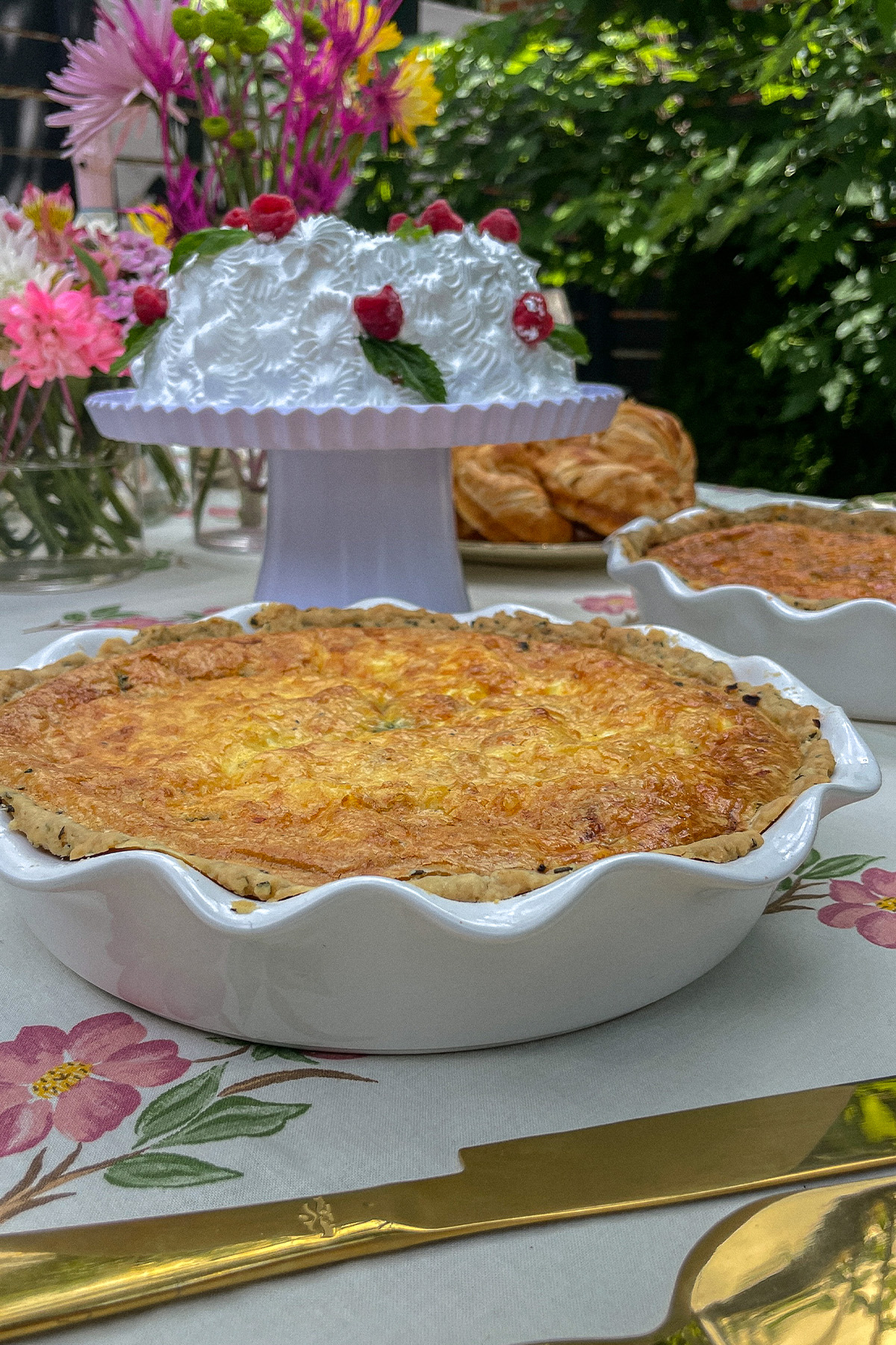 Italian Sausage Red Pepper Quiche in a white ruffle pie pan