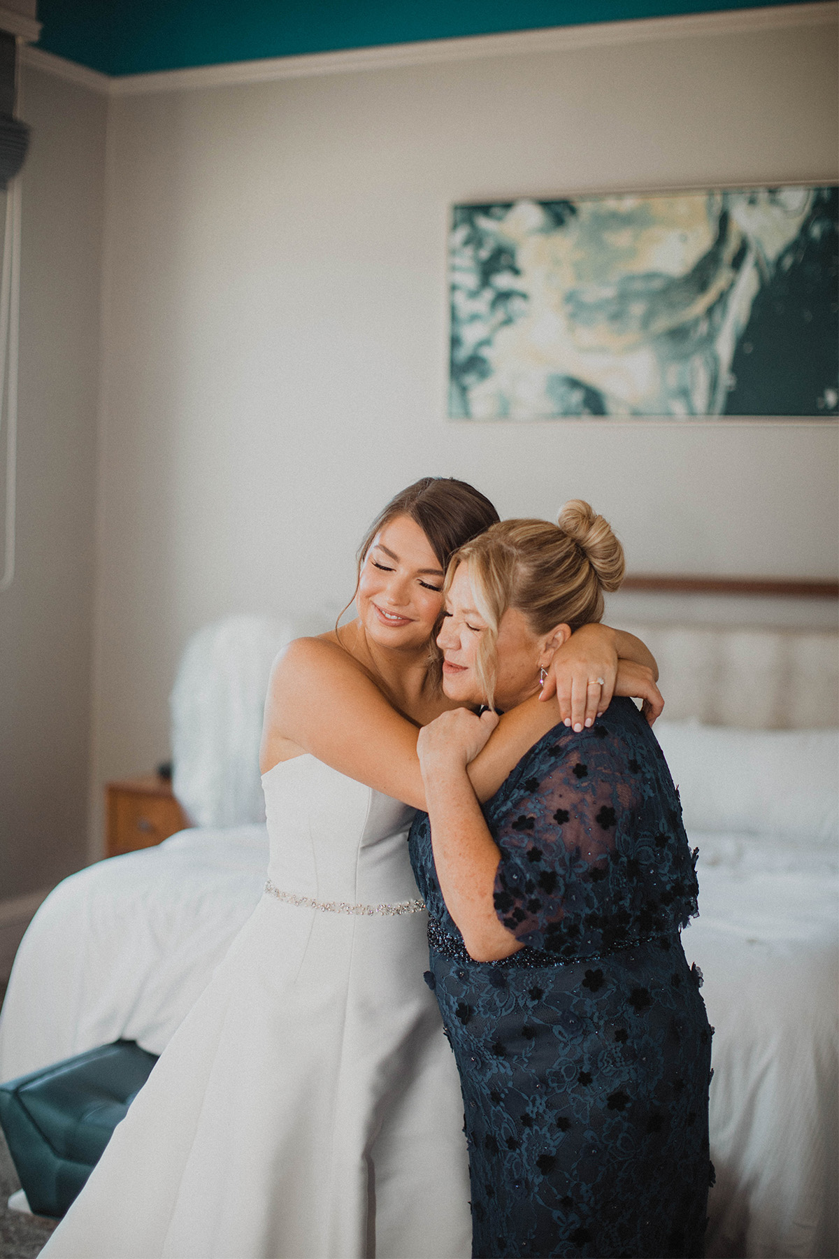 Bride and her mother sharing a hug before the ceremony