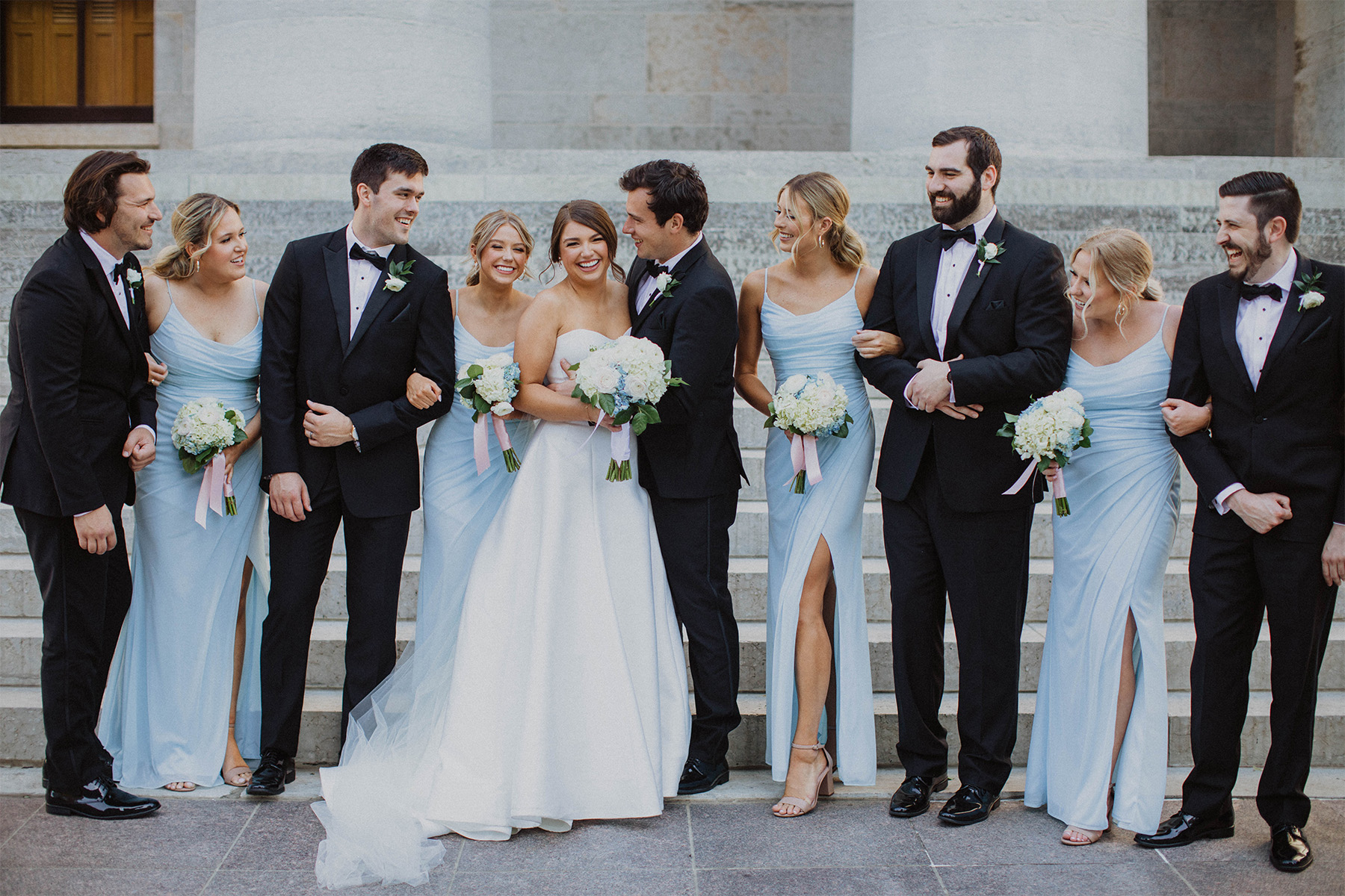 Bridal party posing in front of the Ohio Statehouse