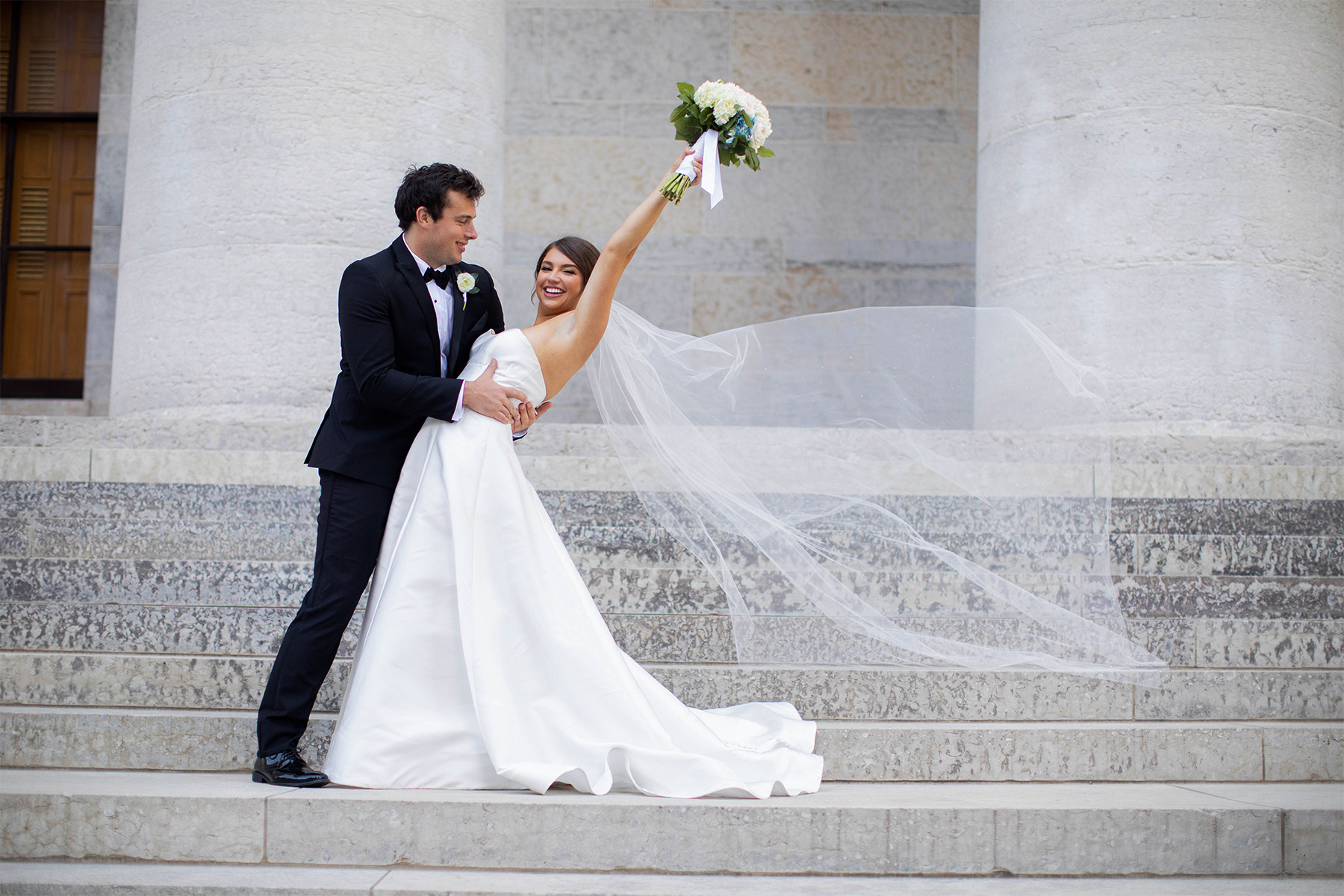 Bride and groom posing in downtown Columbus, Ohio