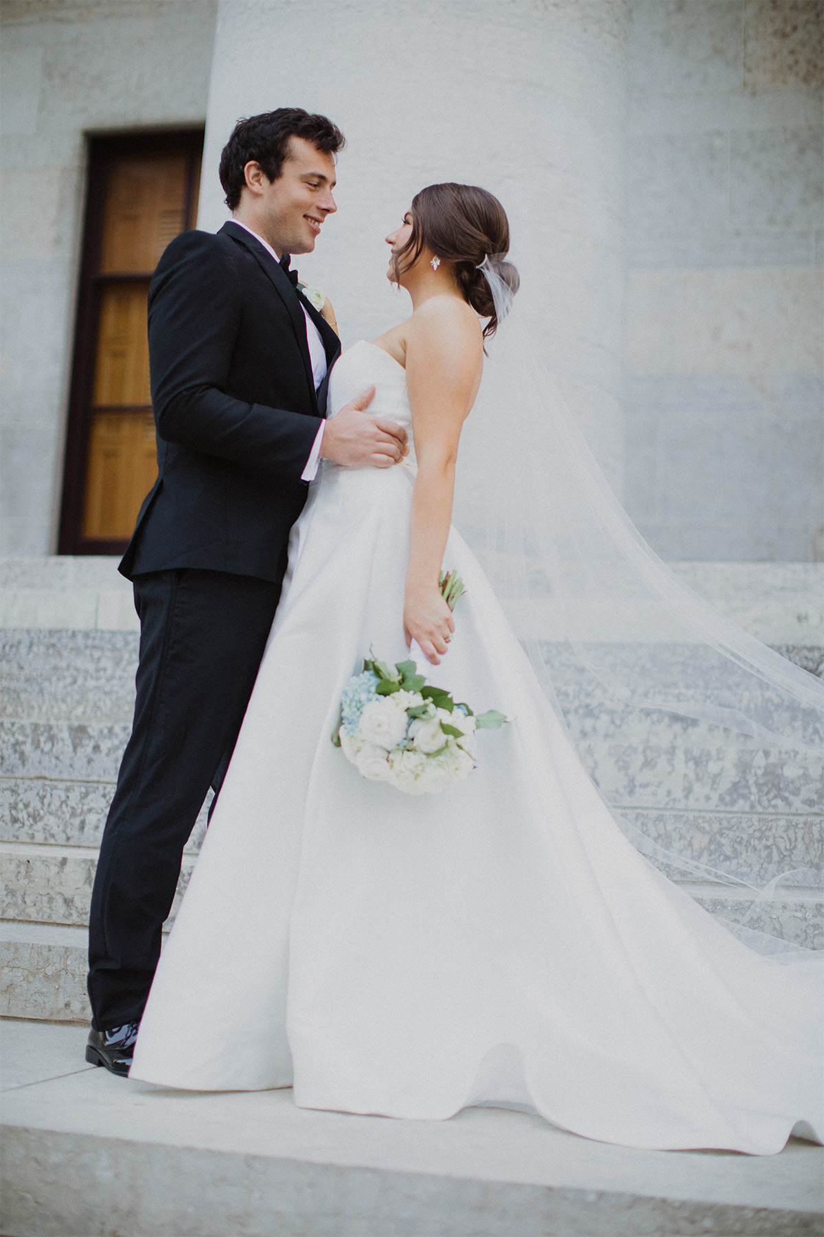 Bride and groom posing in downtown Columbus, Ohio