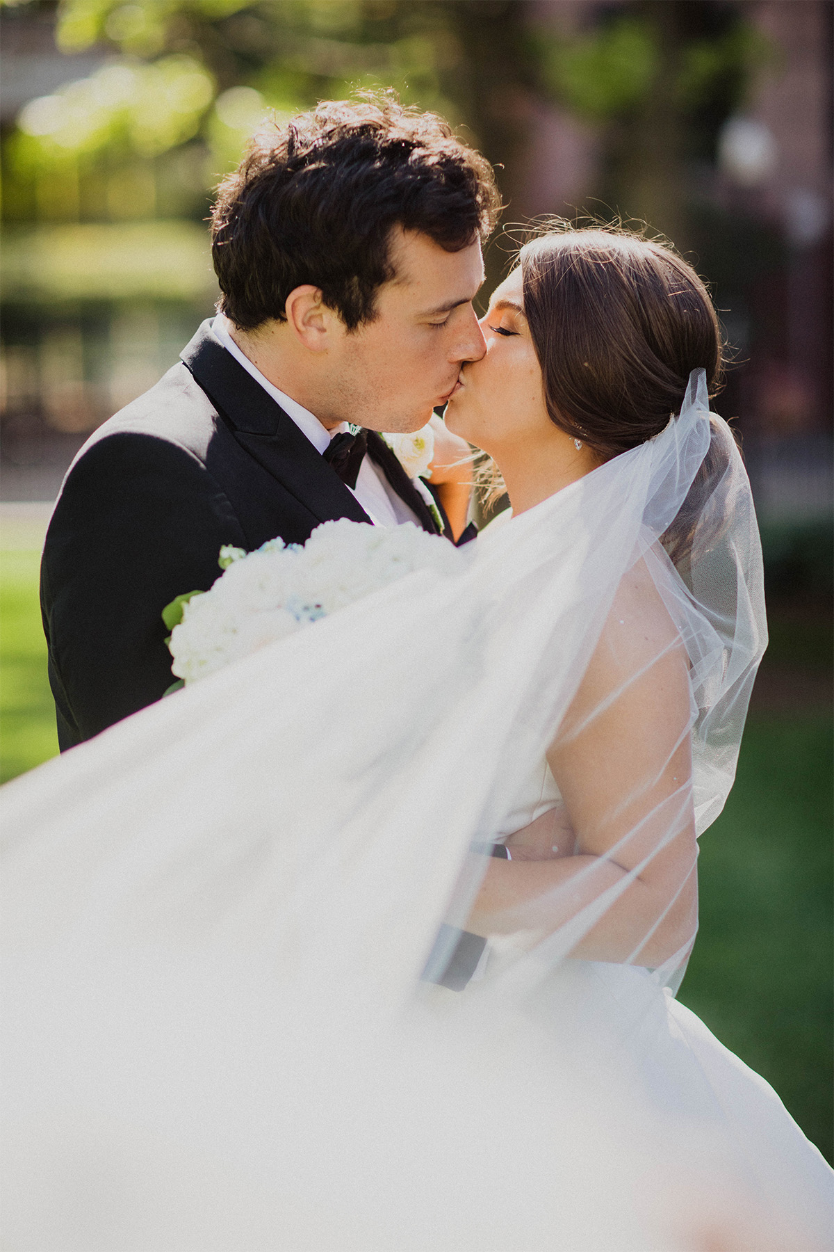 Bride and groom sharing a kiss in downtown Columbus, Ohio