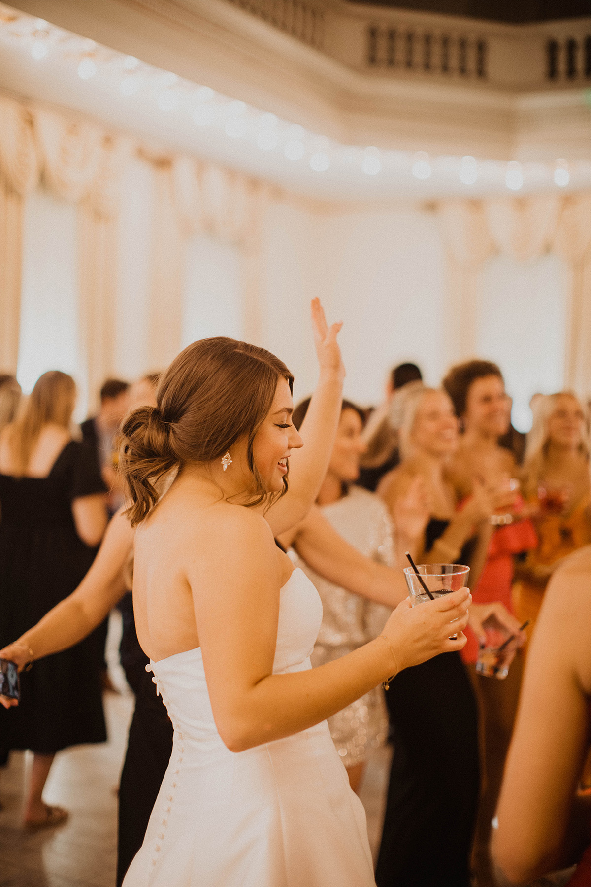 Bride dancing with friends at the reception