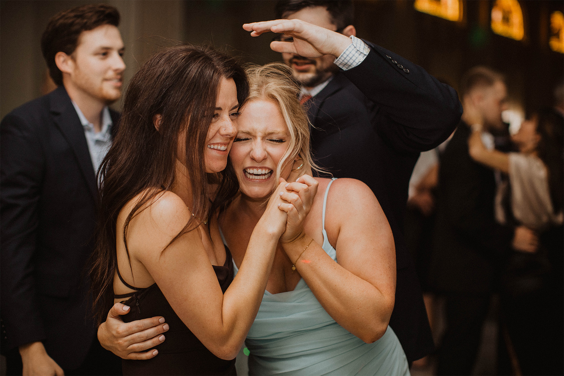 Friends dancing at wedding reception