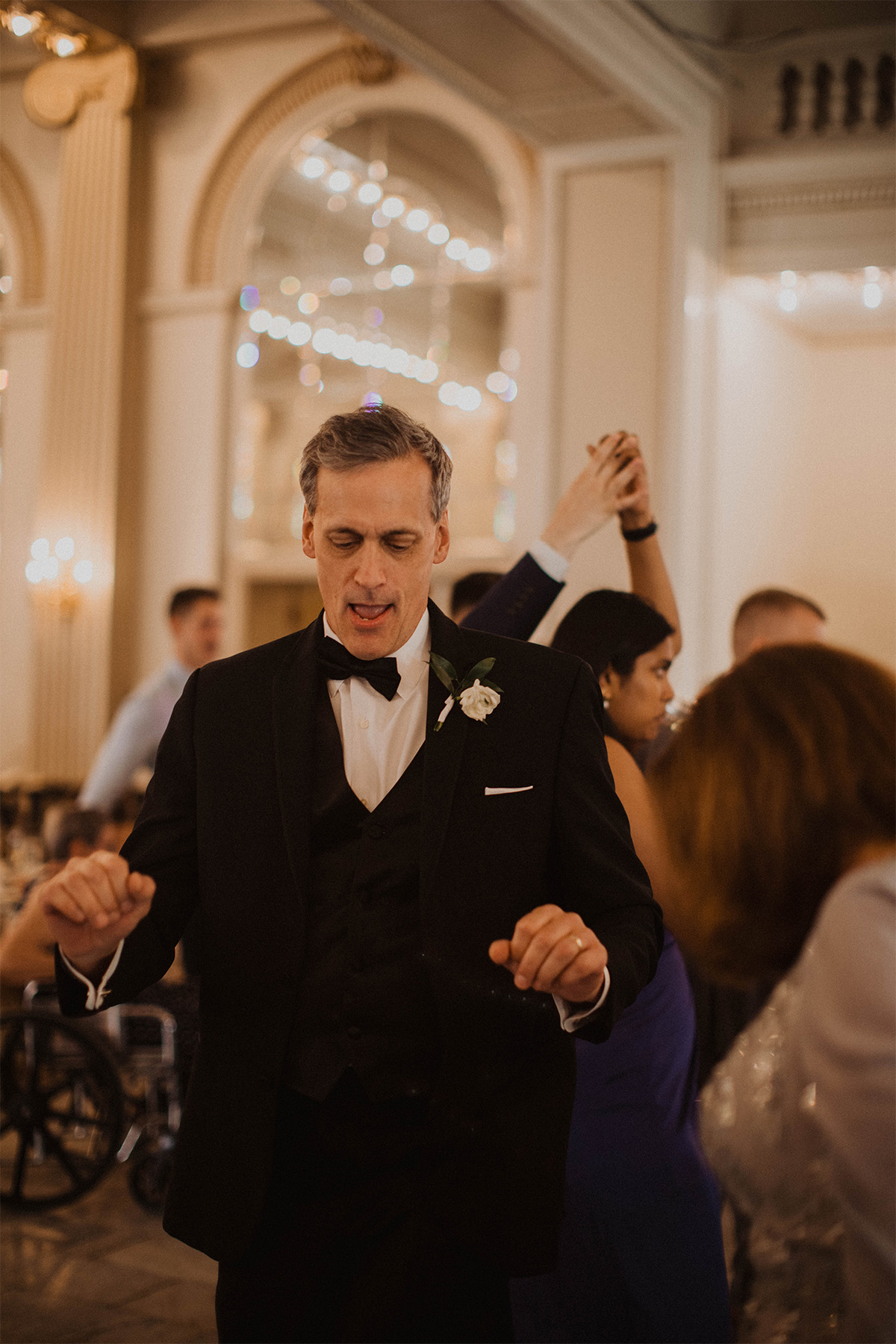 Groom's father dancing at wedding reception