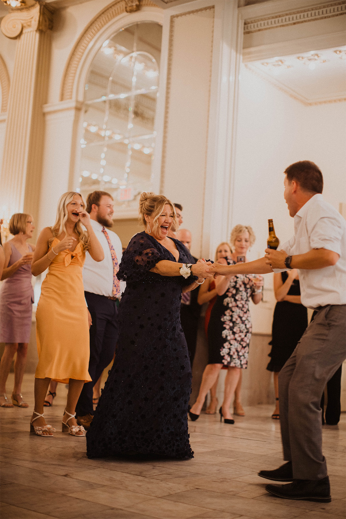 Mother of the bride dancing at wedding reception