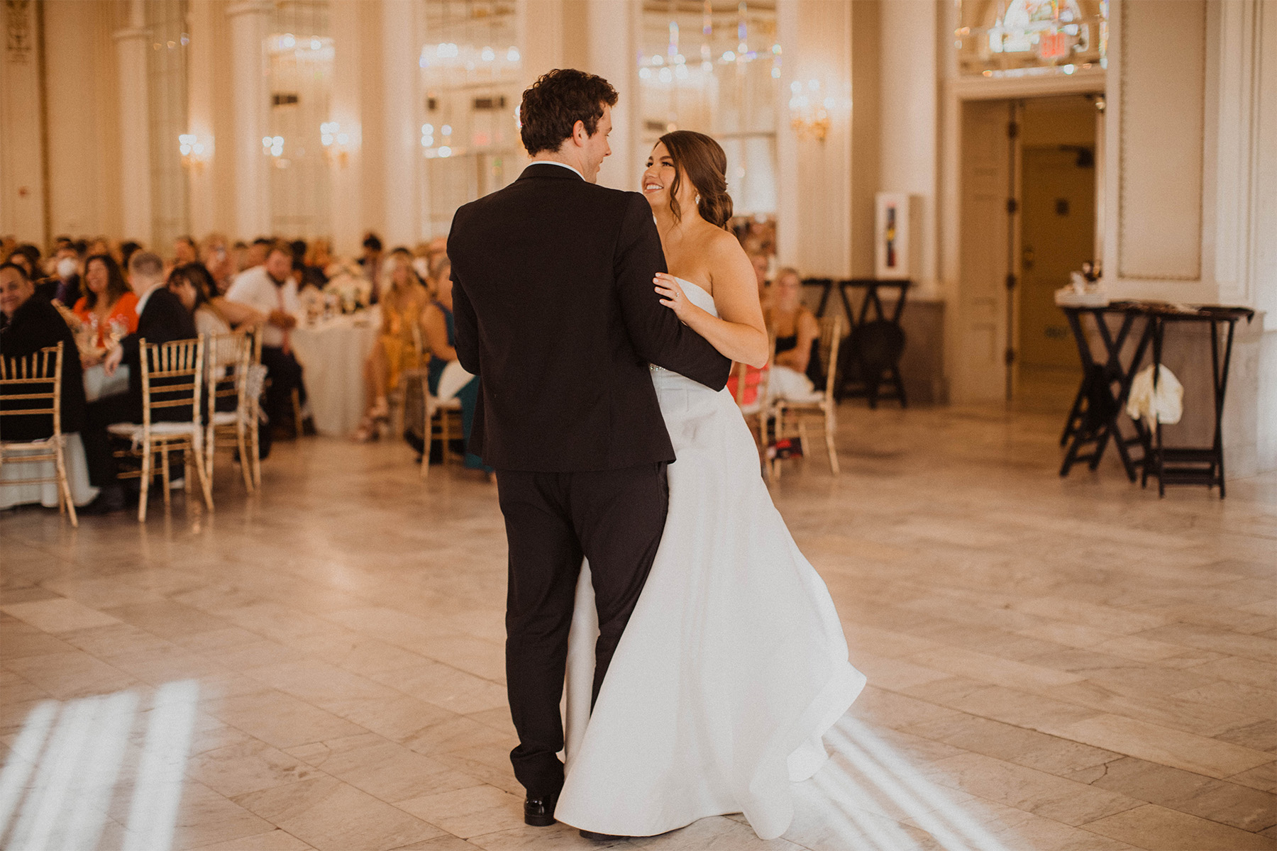 Bride and groom sharing their first dance at the wedding reception