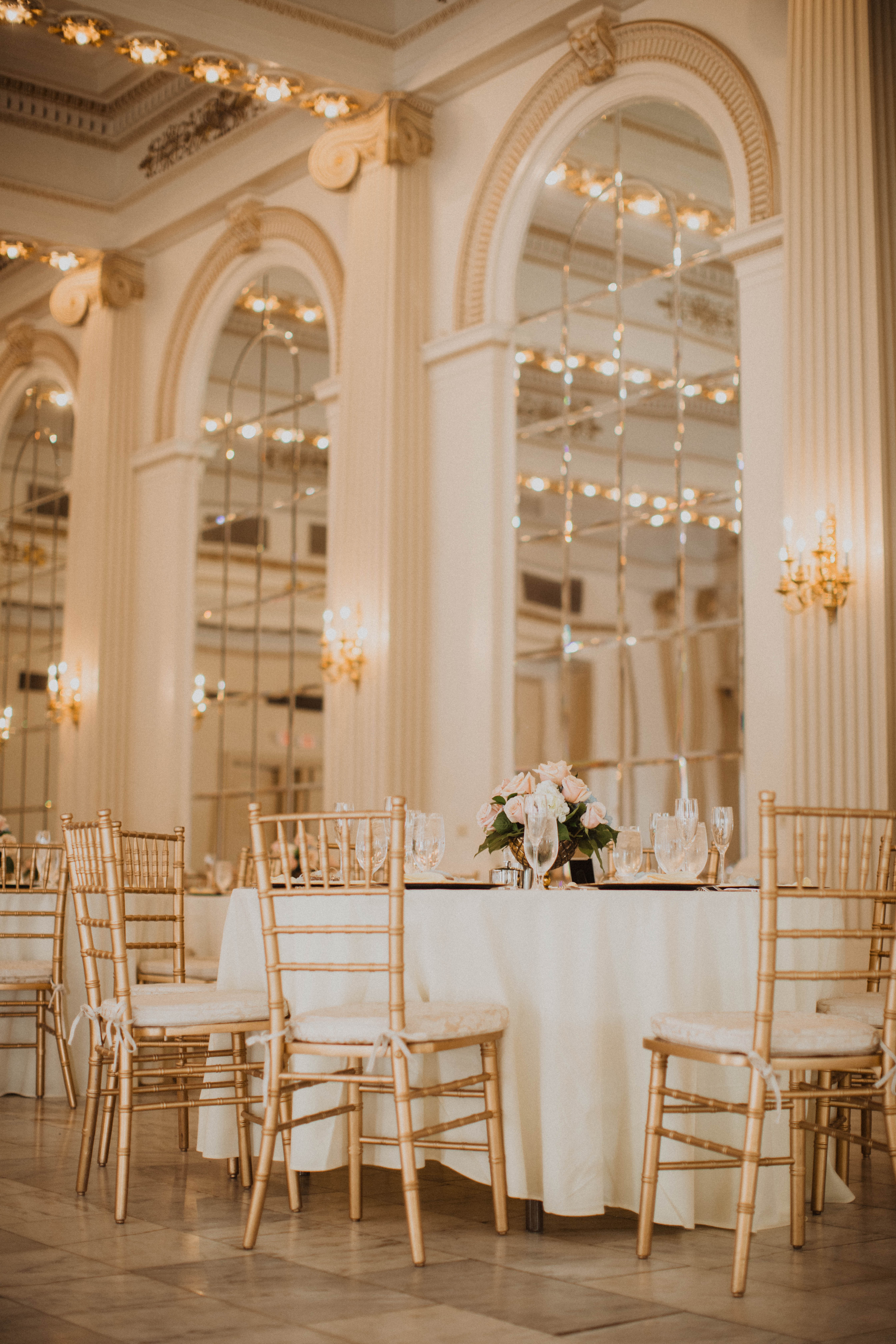 Gold ballroom wedding venue with mirrored walls