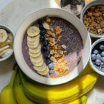 Blueberry Smoothie Bowl topped with sliced bananas, blueberries, granola and chia seeds