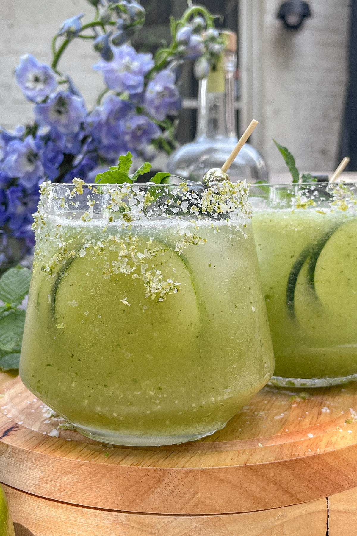 Cucumber Mint Margaritas served in rocks glasses with cucumber and mint garnish