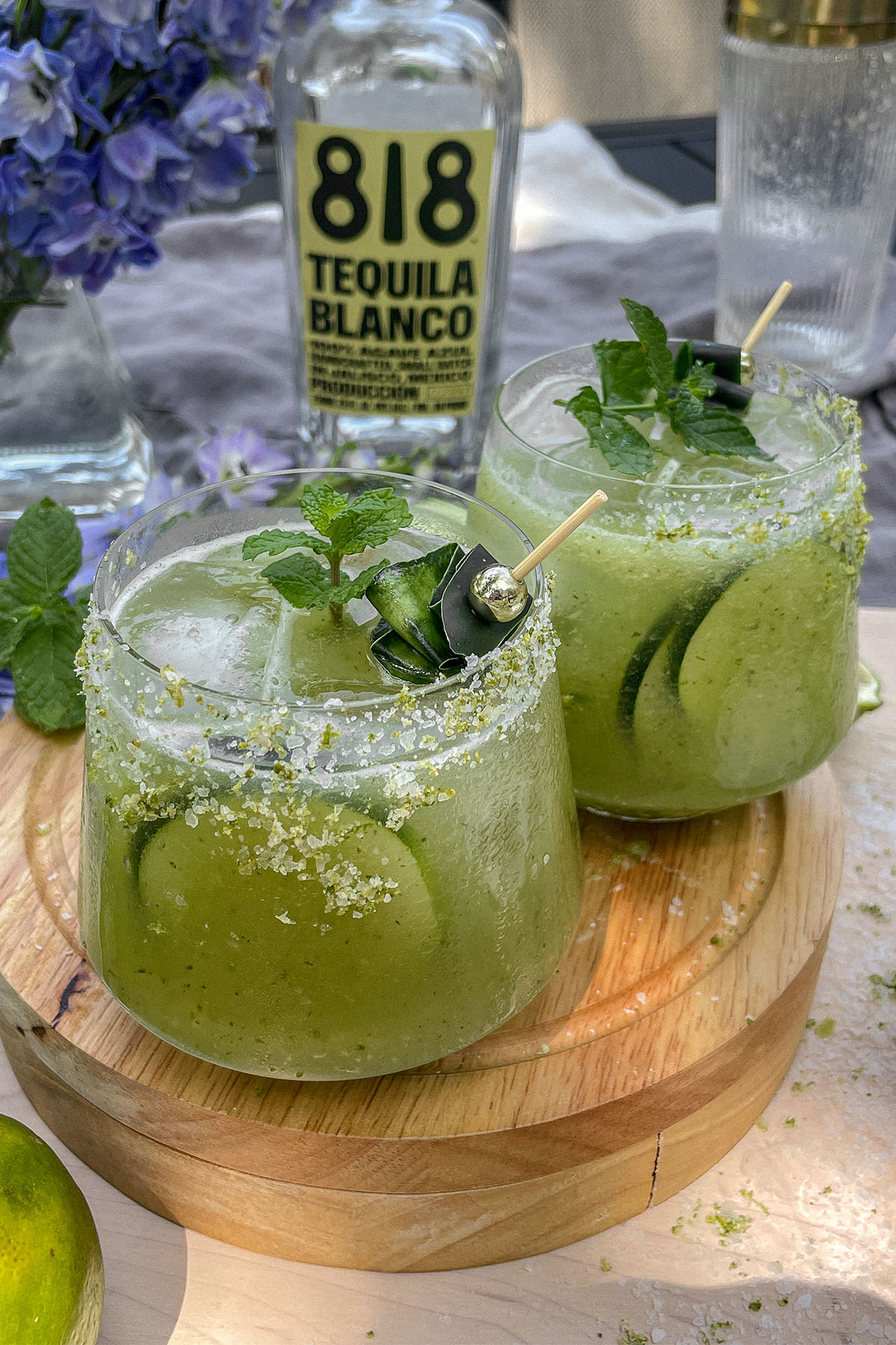 Cucumber Mint Margaritas served in rocks glasses with cucumber and mint garnish