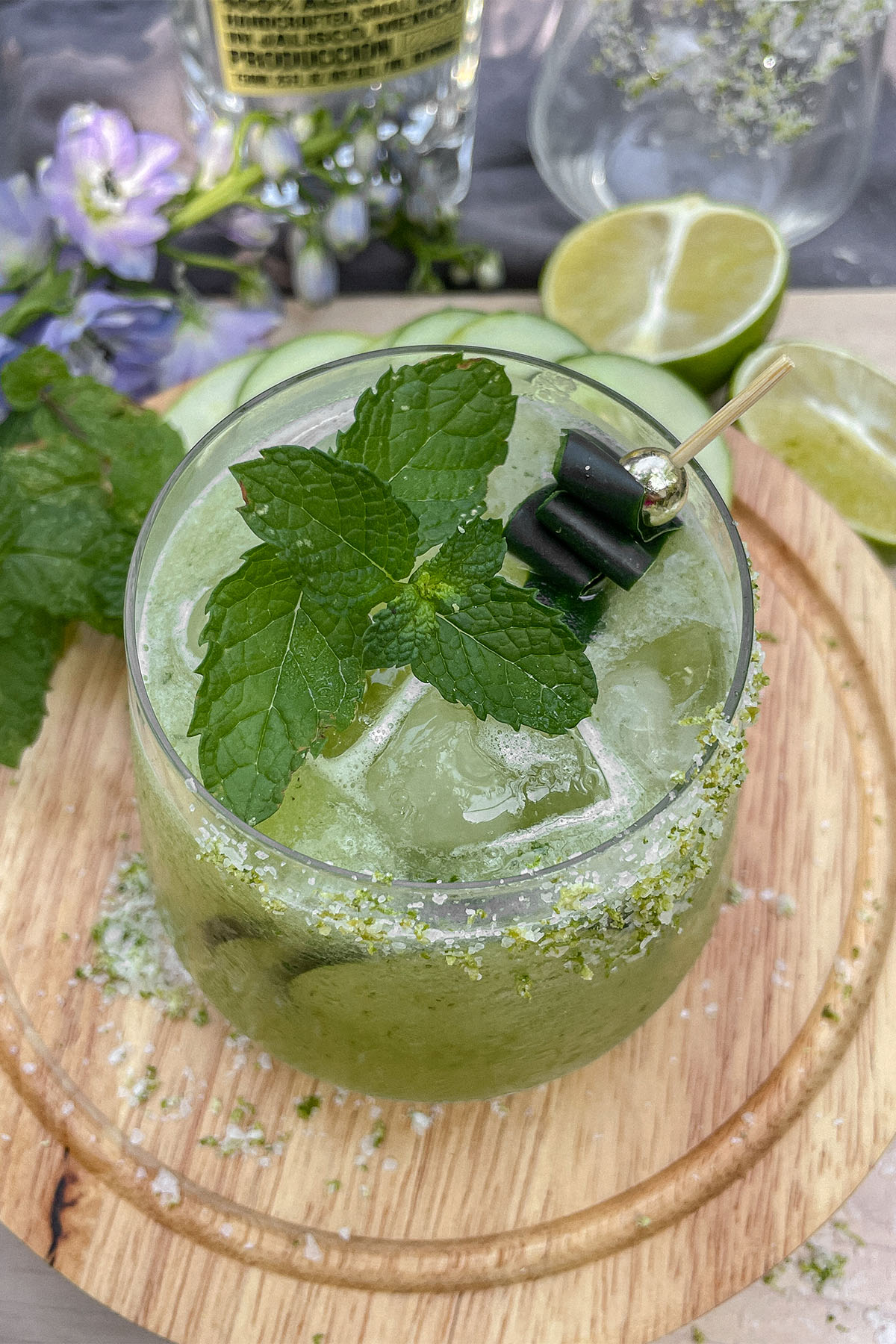 Cucumber Mint Margarita served in low glass with fresh mint and cucumber garnish