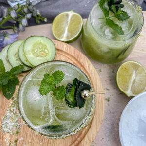 Cucumber Mint Margaritas served in rocks glasses with fresh mint and cucumber garnish