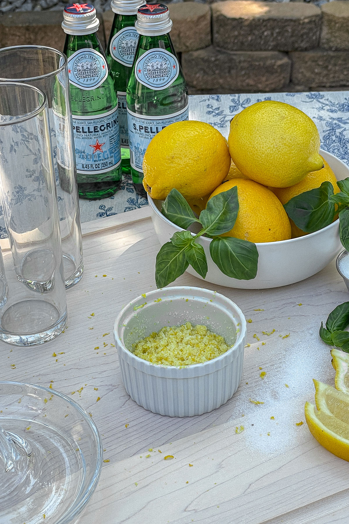 Sparkling Basil Lemonade Cocktail ingredients on a wooden cutting board