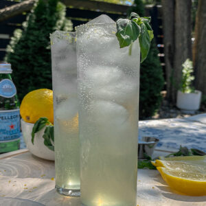 Two Sparkling Basil Lemonade Cocktails served in slim glasses