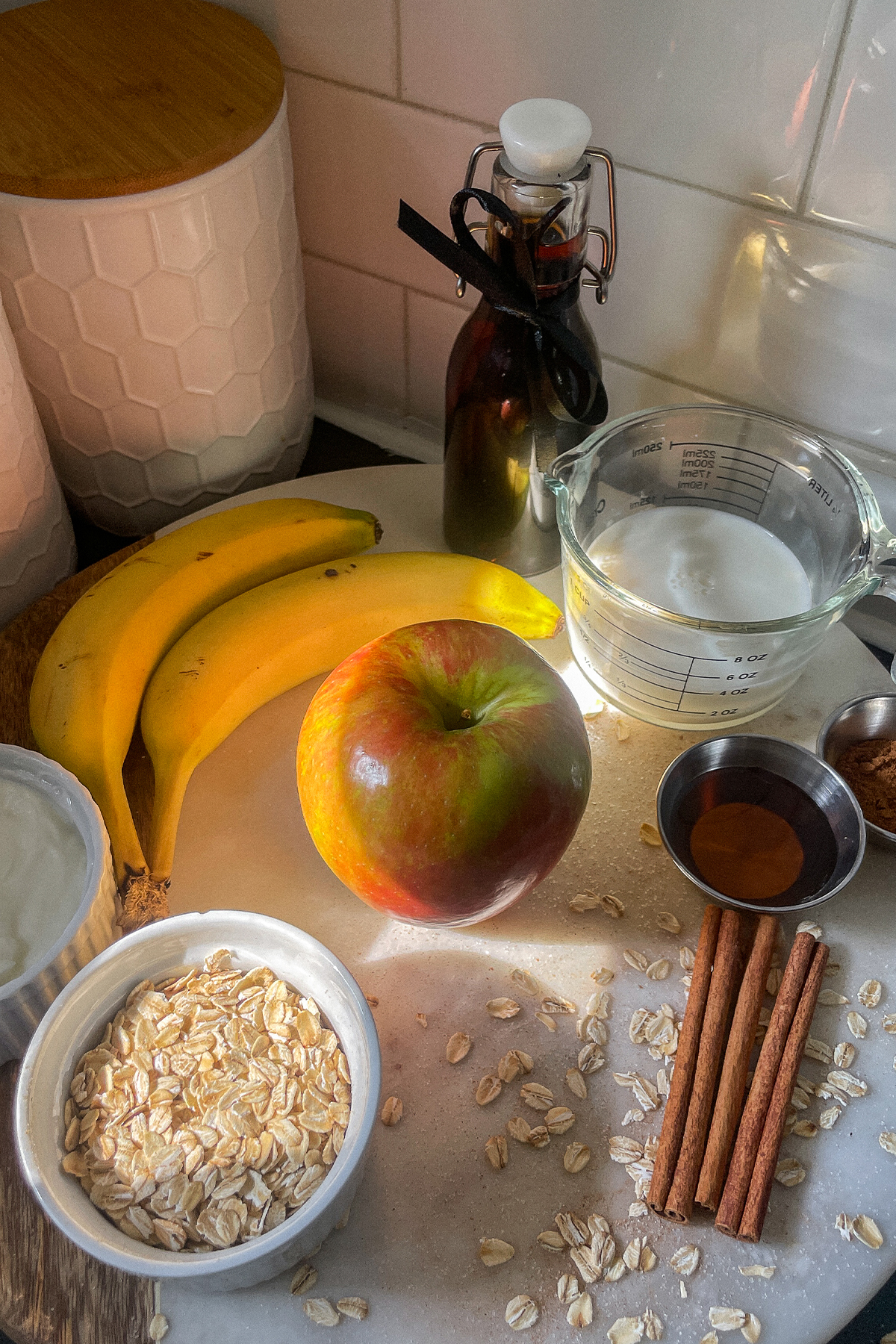 Maple Apple Crisp Smoothie ingredients on a cutting board