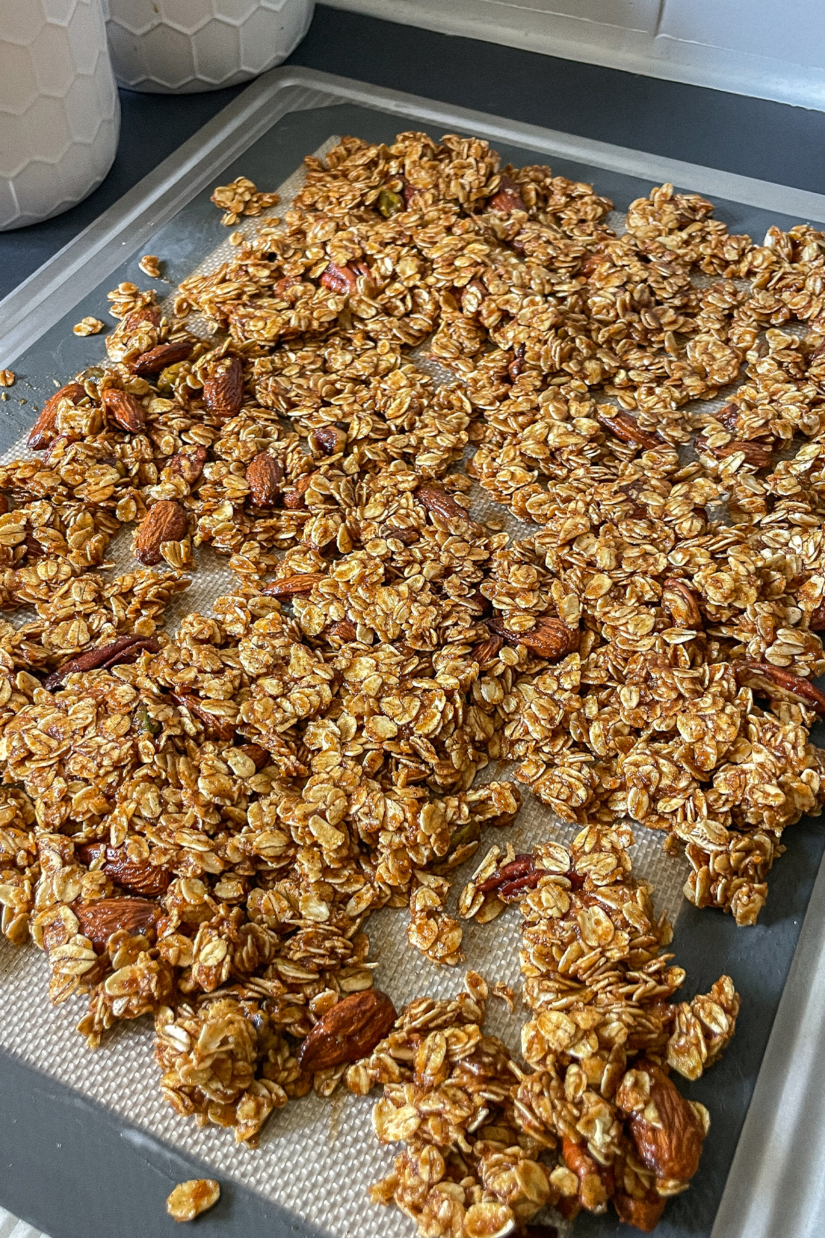 Fall Pumpkin Spice Granola spread on a baking sheet