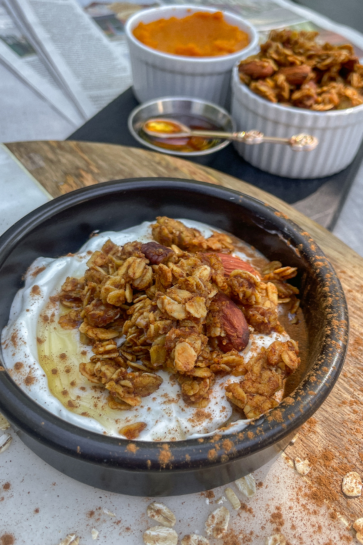 Yogurt parfait topped with maple syrup, cinnamon and Fall Pumpkin Spice Granola