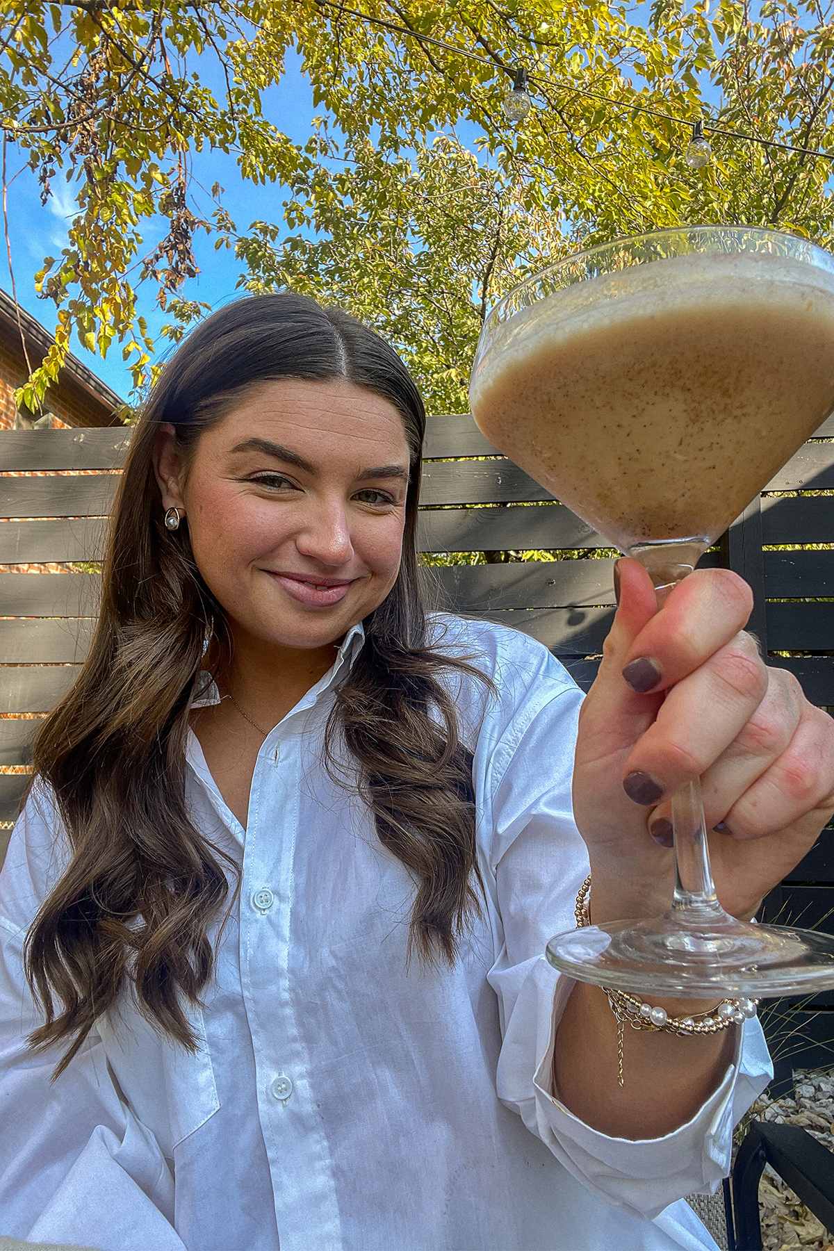 Tristen holding a Pumpkin Spice RumChata Martini