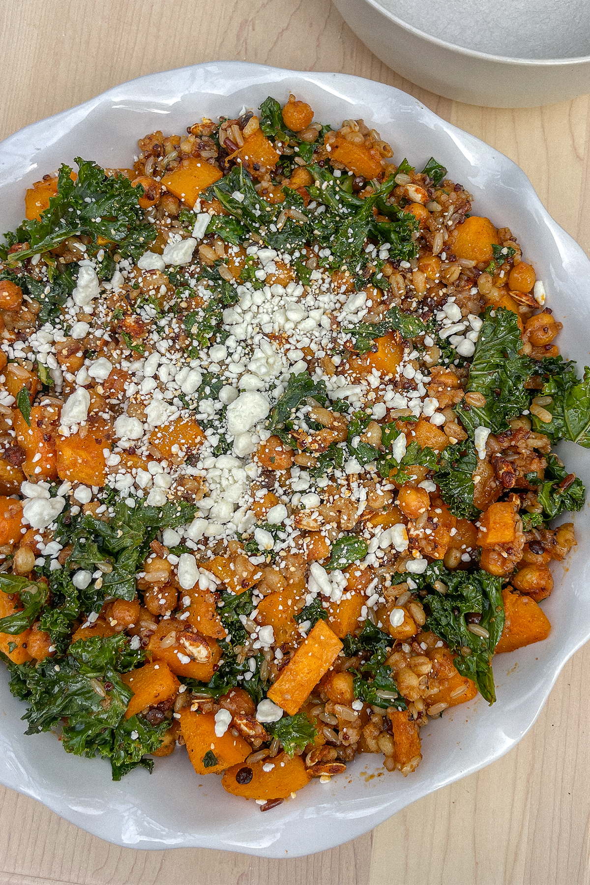 Roasted Butternut Squash Quinoa Salad in a ruffle pie dish