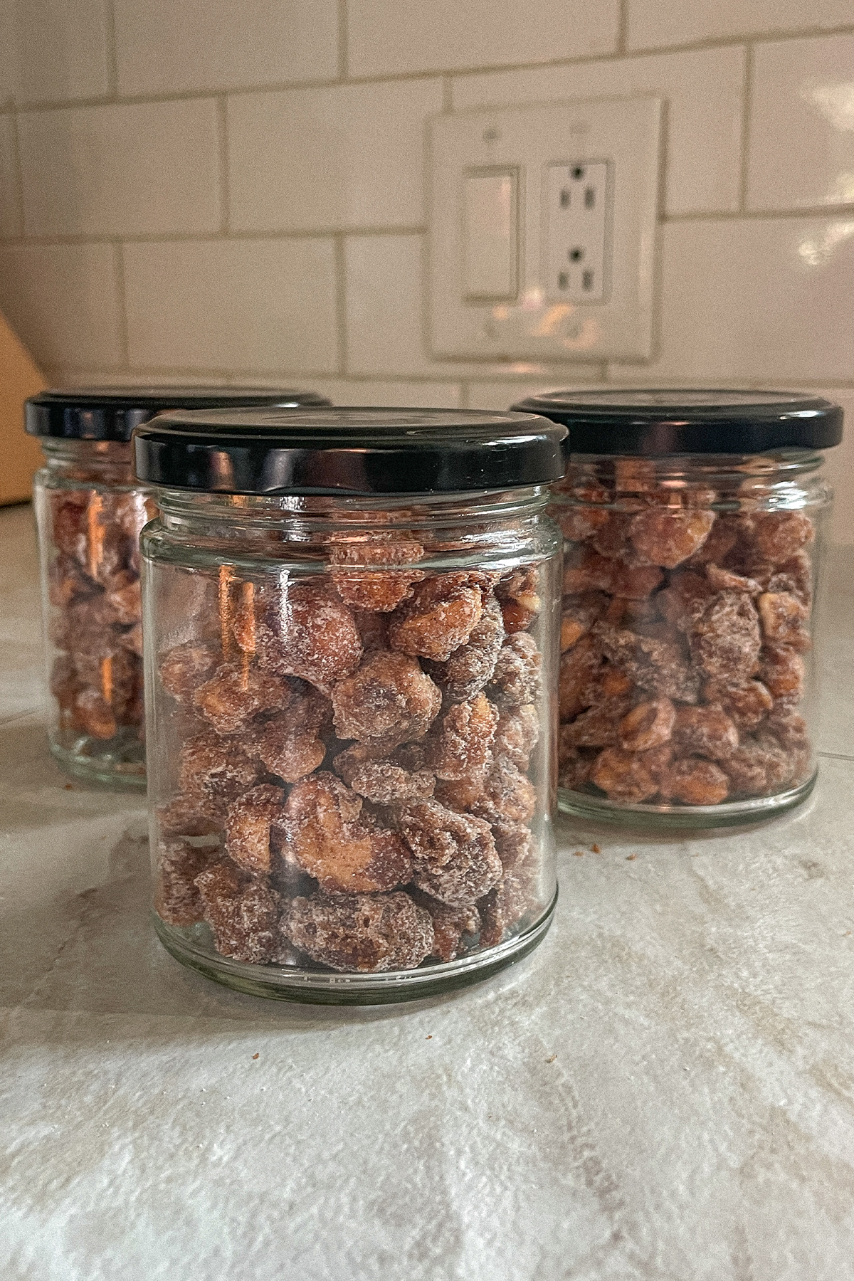 Jars filled with homemade candied nuts