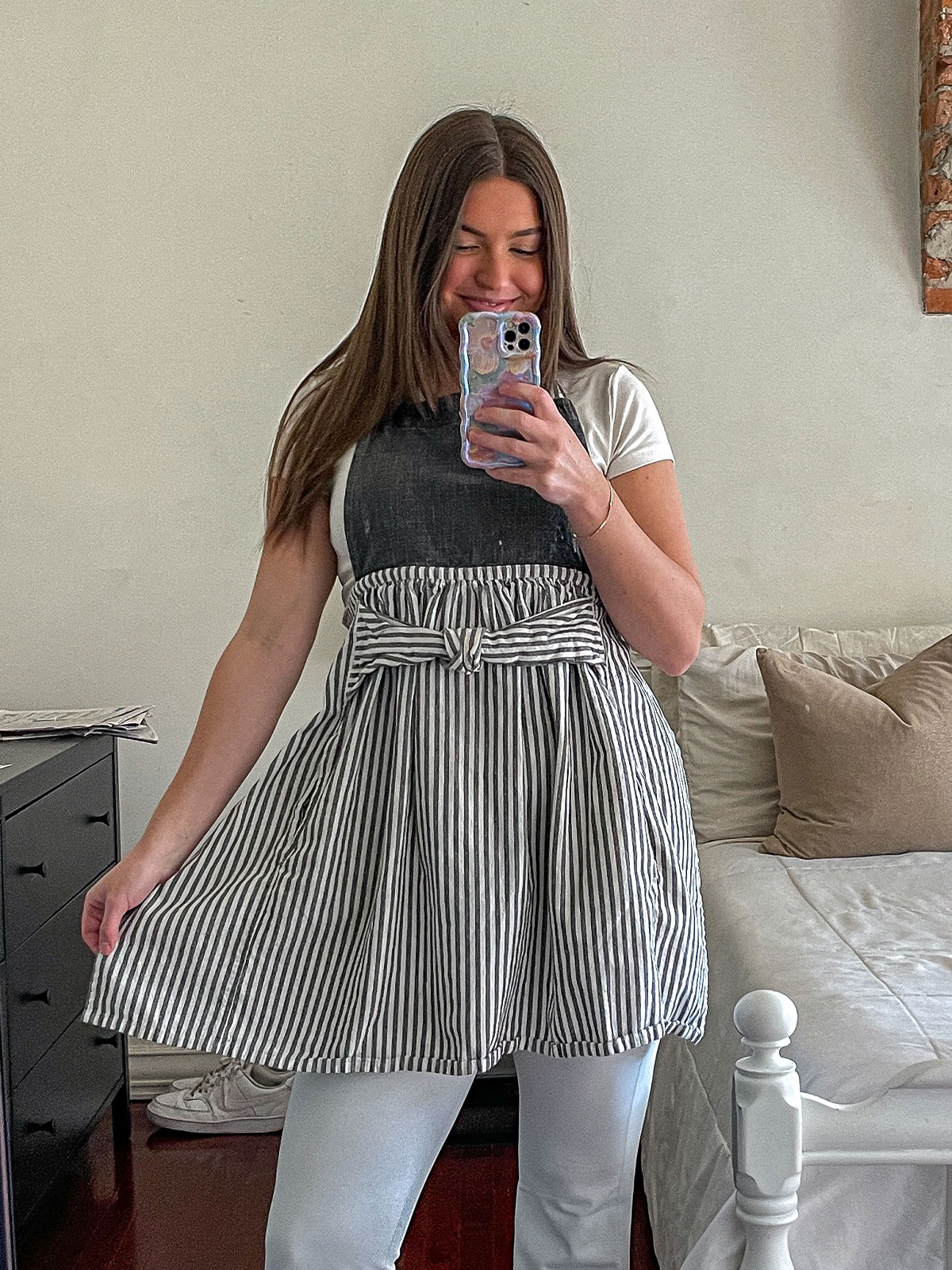 Tristen wearing a grey striped apron