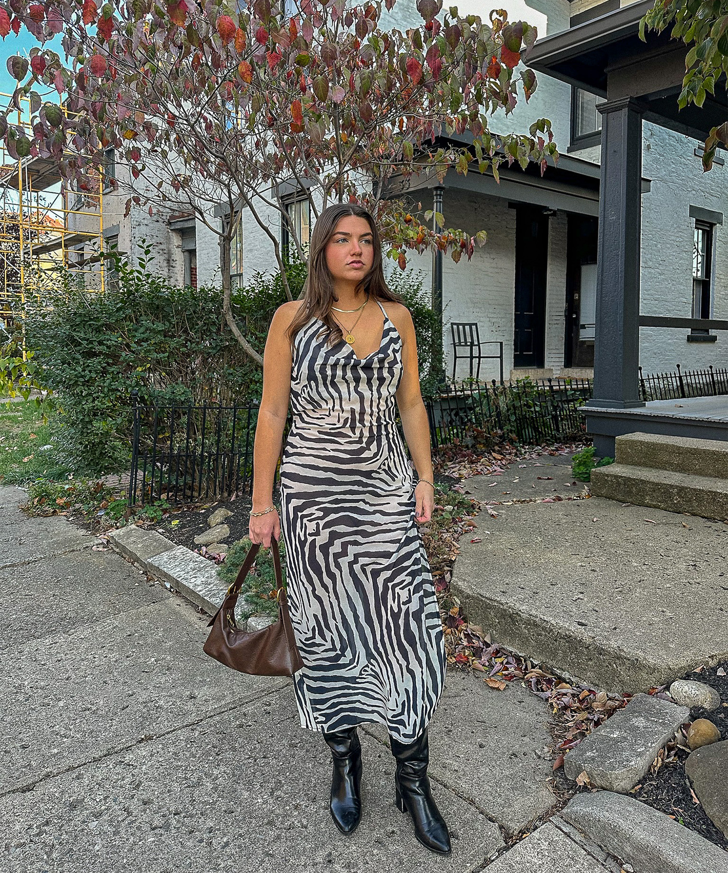 Tristen wearing a zebra chiffon maxi dress