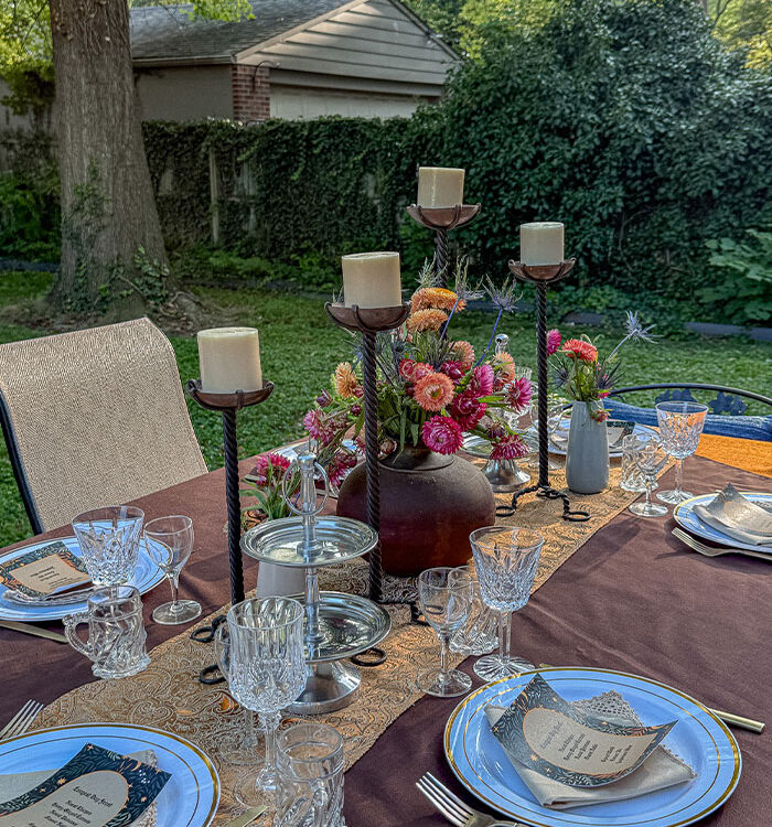 a table set with candles and flowers